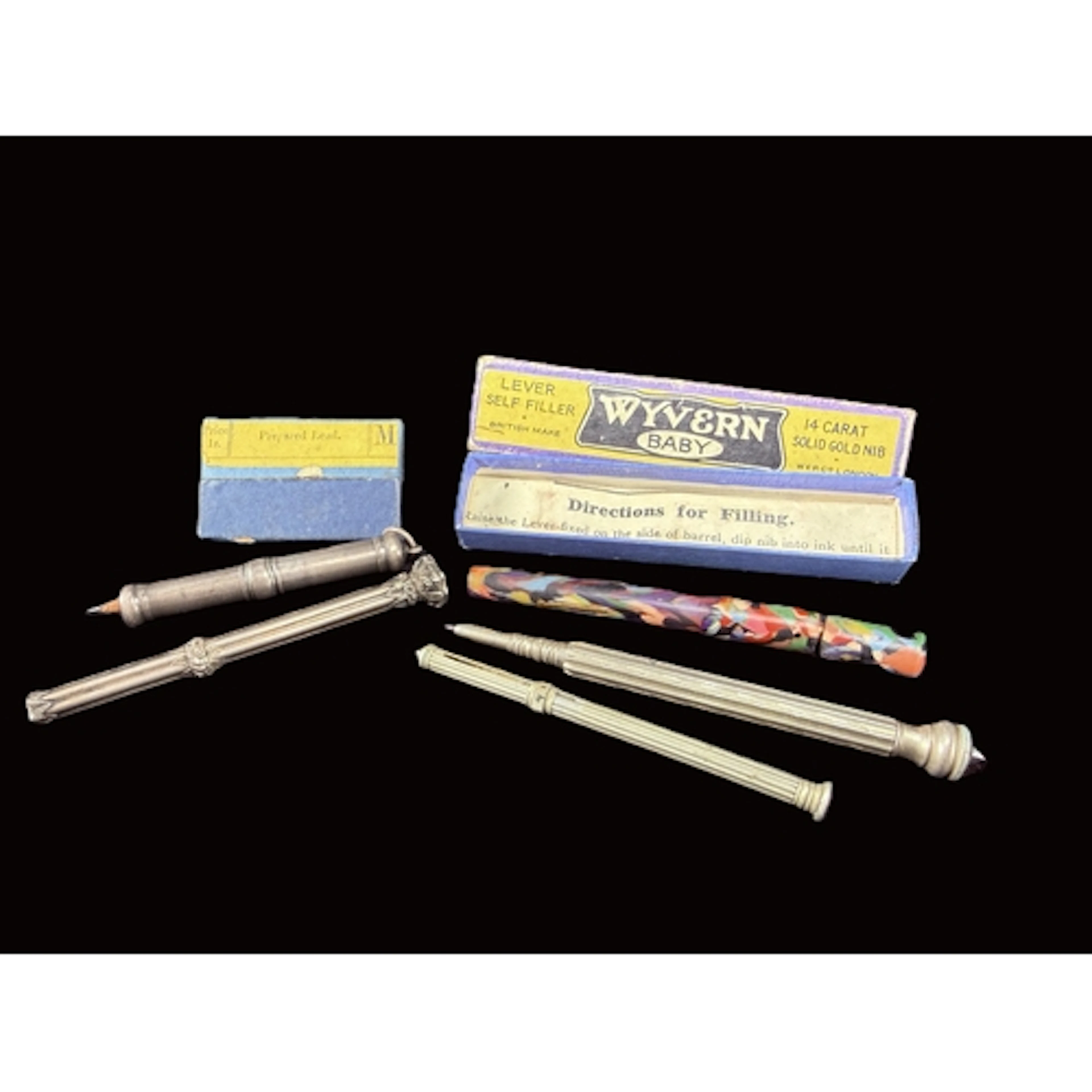 A Samuel Mordan white metal propelling pencil with seal ston...