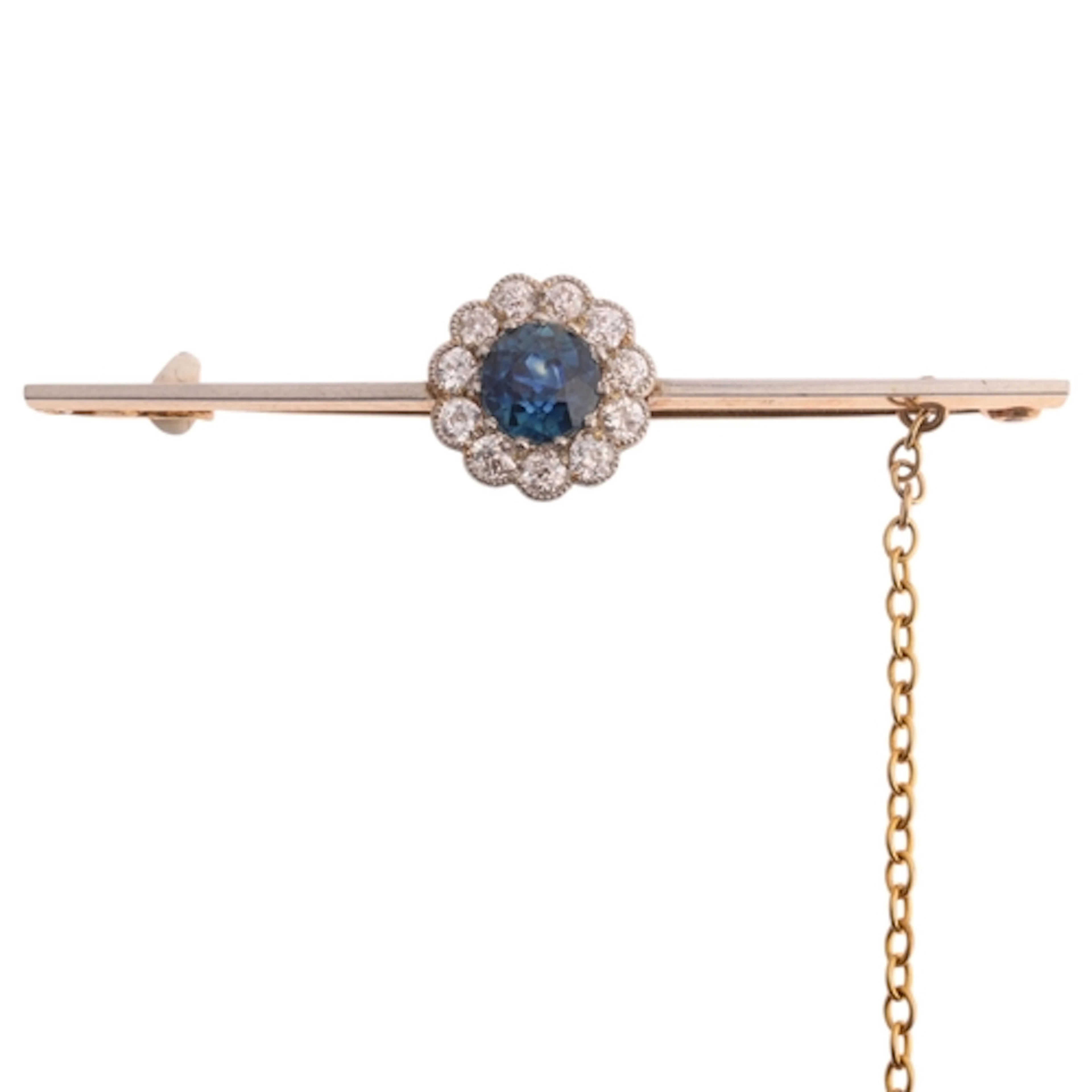 An 18ct gold sapphire and diamond cluster bar brooch, claw s...