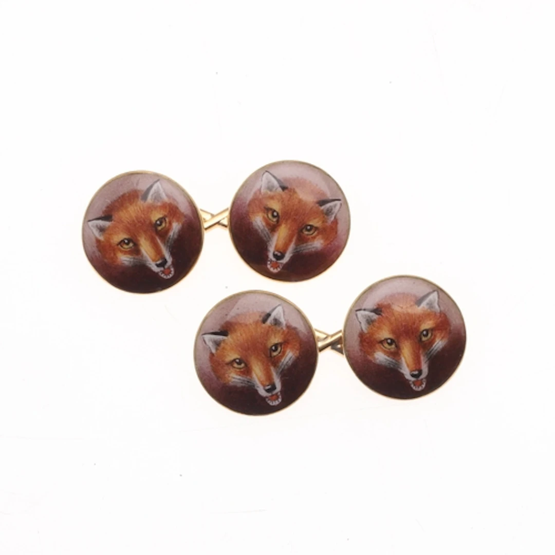 A PAIR OF 18CT GOLD AND ENAMEL FOX MASK CUFFLINKS. each link...