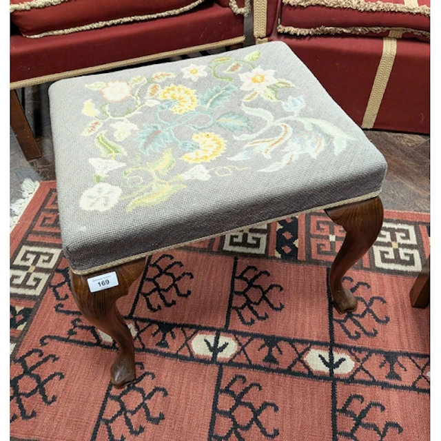 A mahogany framed dressing stool on cabriole legs with tapes...