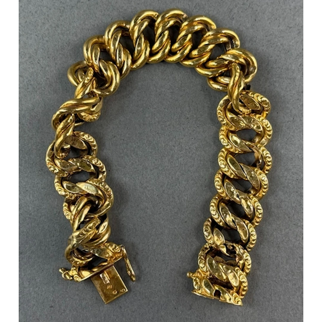 Jewellery: a French yellow metal hollow double curb link bra...