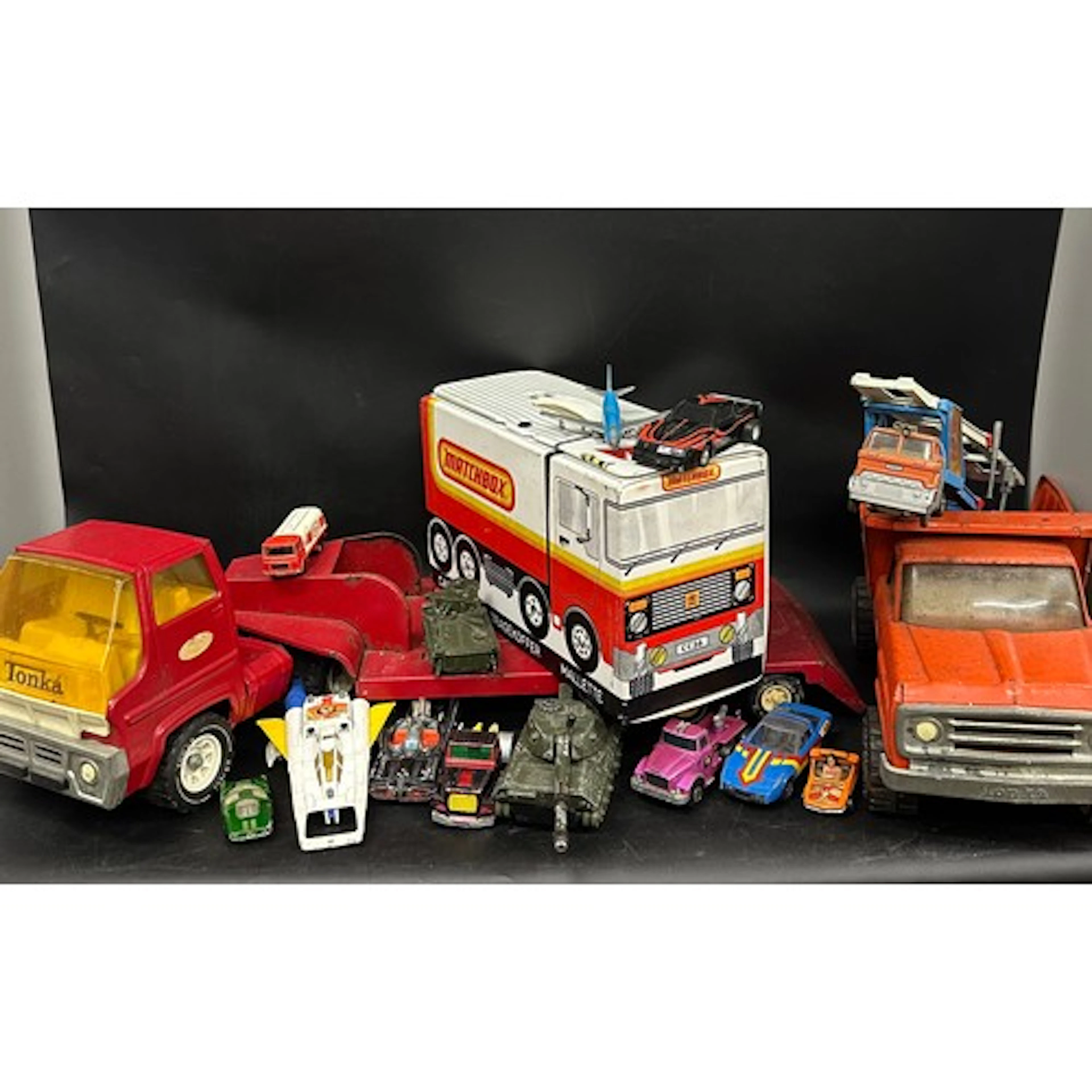 A collection of vintage playworn die-cast model vehicles inc...