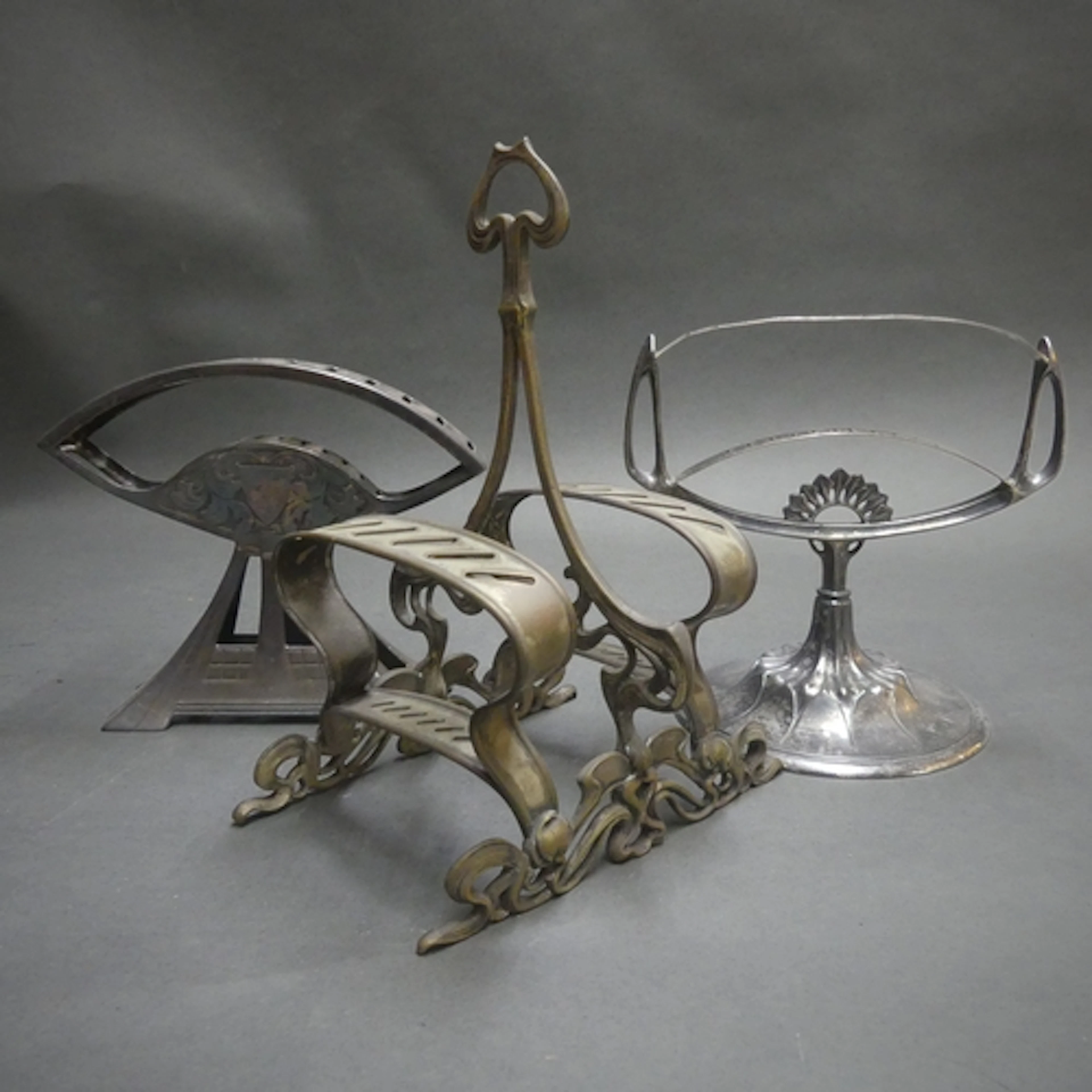 Three Art Nouveau knife stands, one labeled for Plewkiewicz,...