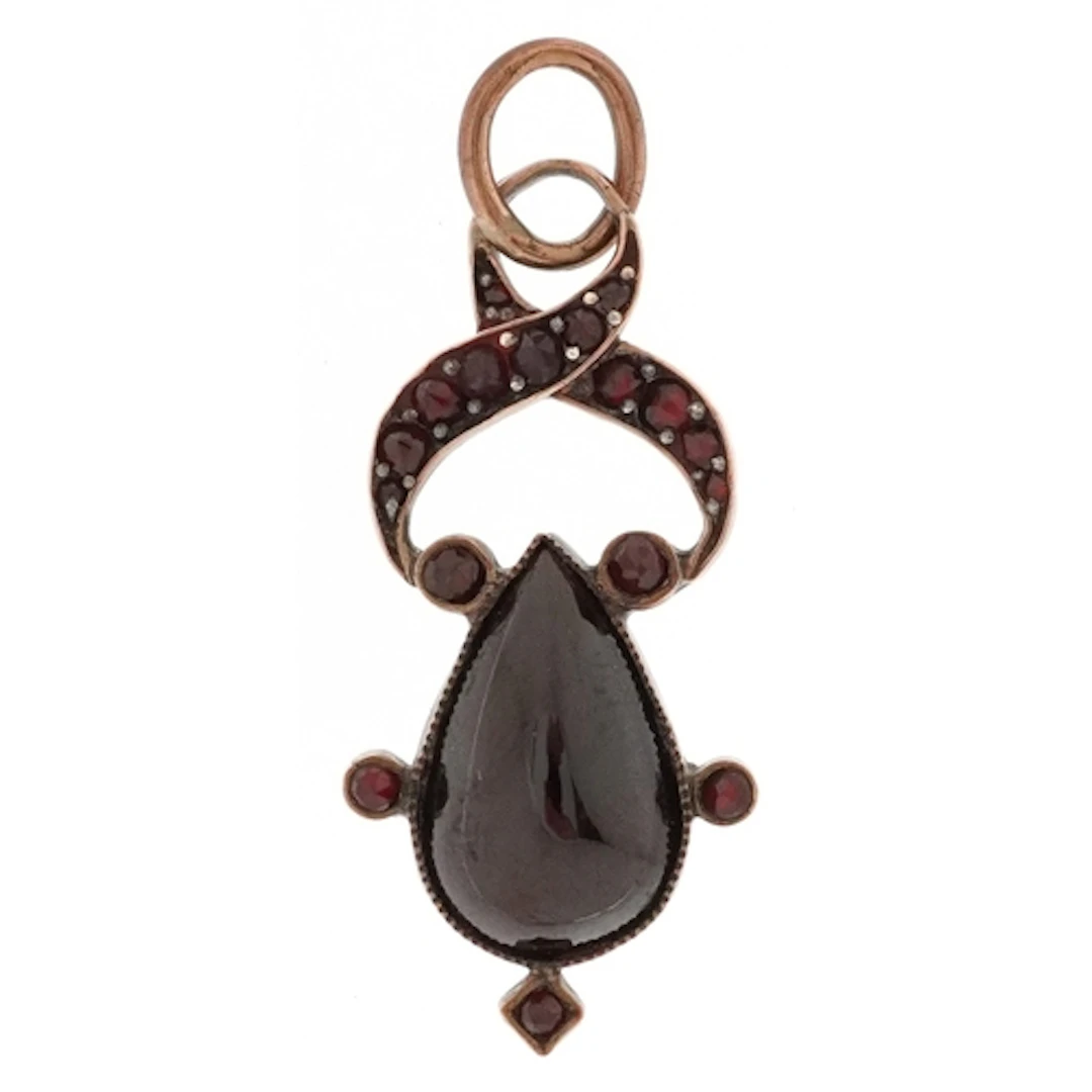 Antique yellow metal garnet pendant, 3.5cm high, 2.1g.