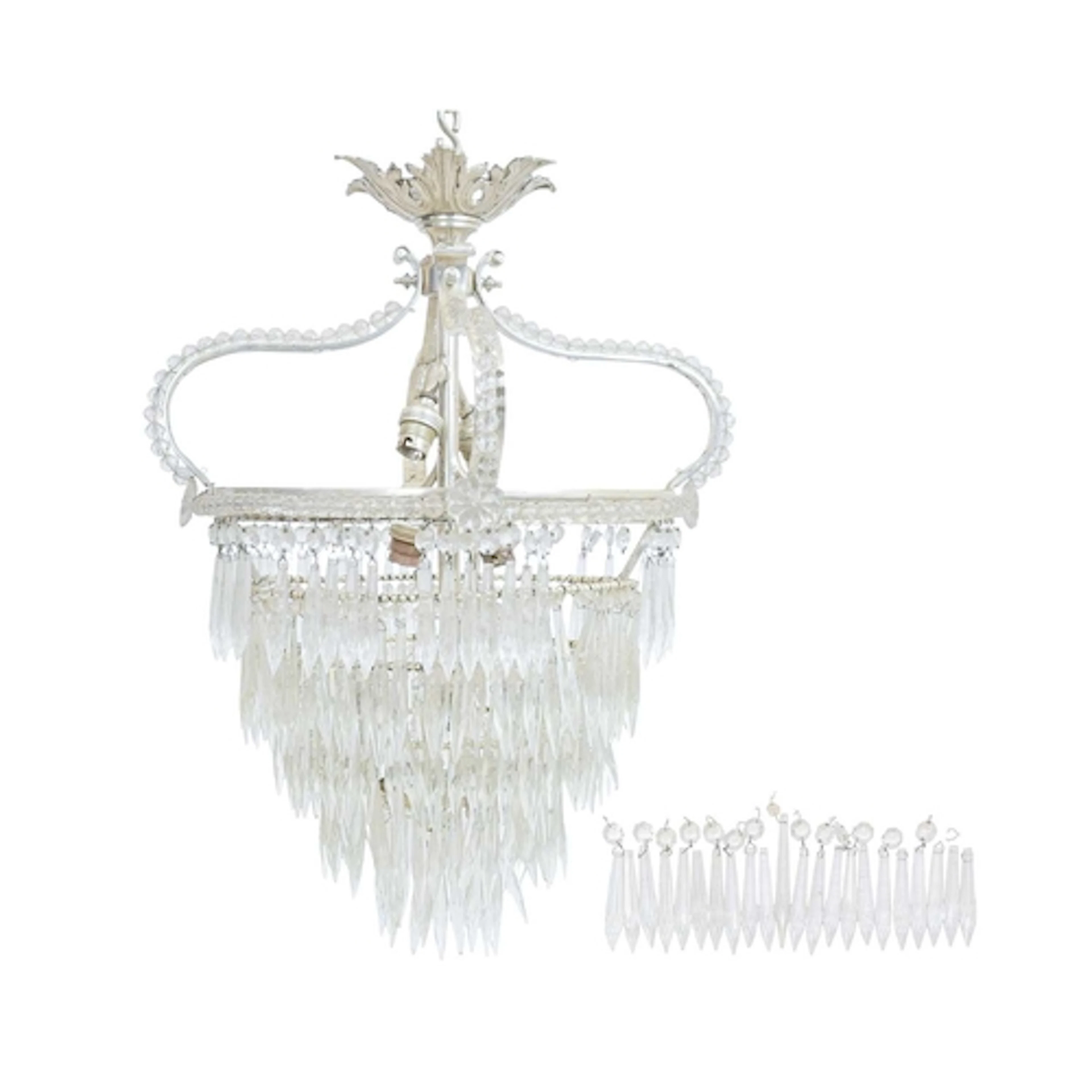 A cut glass chandelier or electrolier. Featuring a white met...