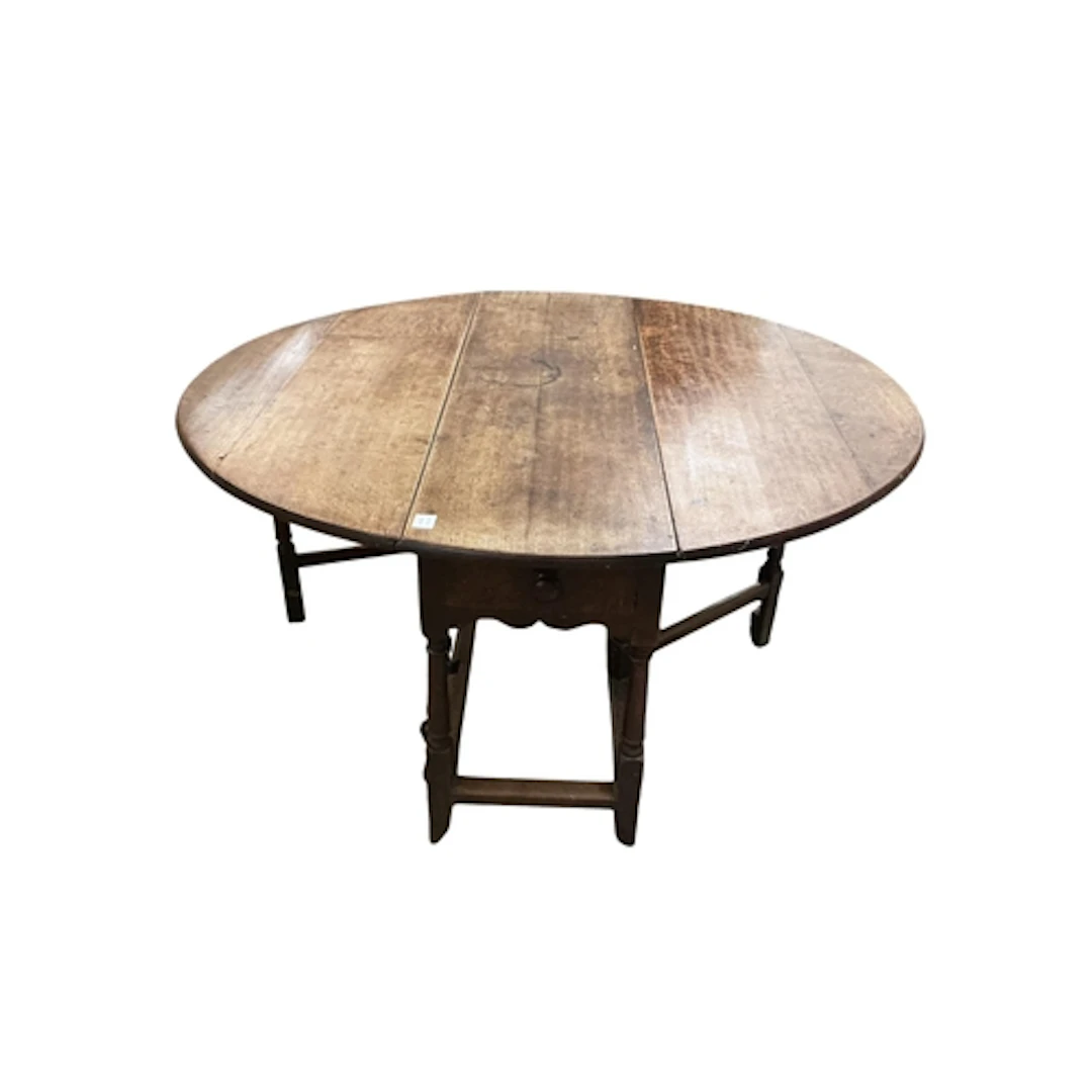 An early 18th century oak gateleg table, width 145cm extende...