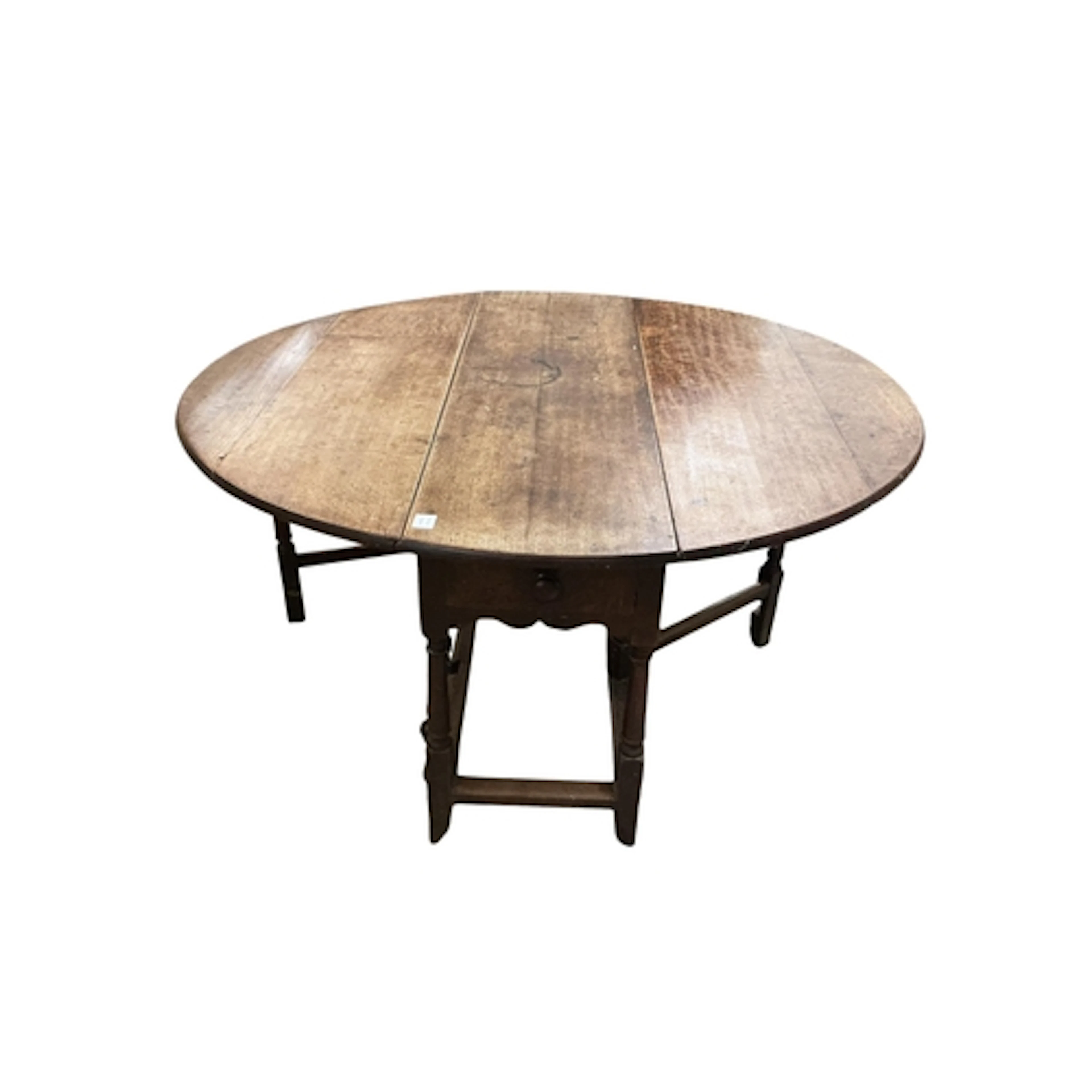 An early 18th century oak gateleg table, width 145cm extende...