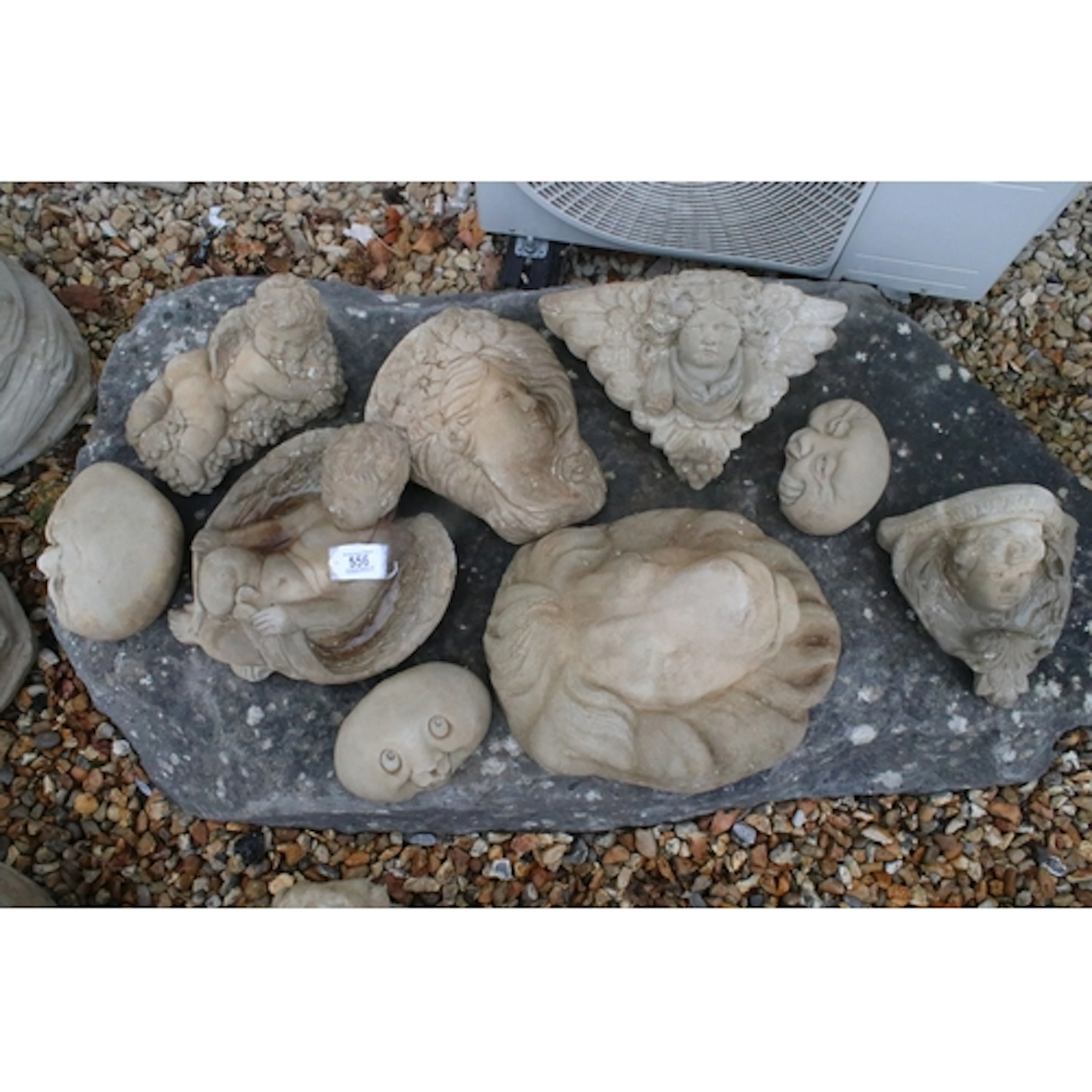 Group of nine reconstituted stone garden ornaments, to compr...