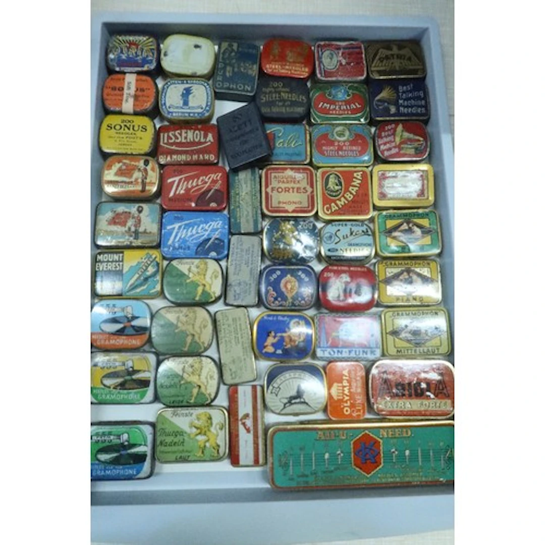 A tray of vintage gramophone needle tins