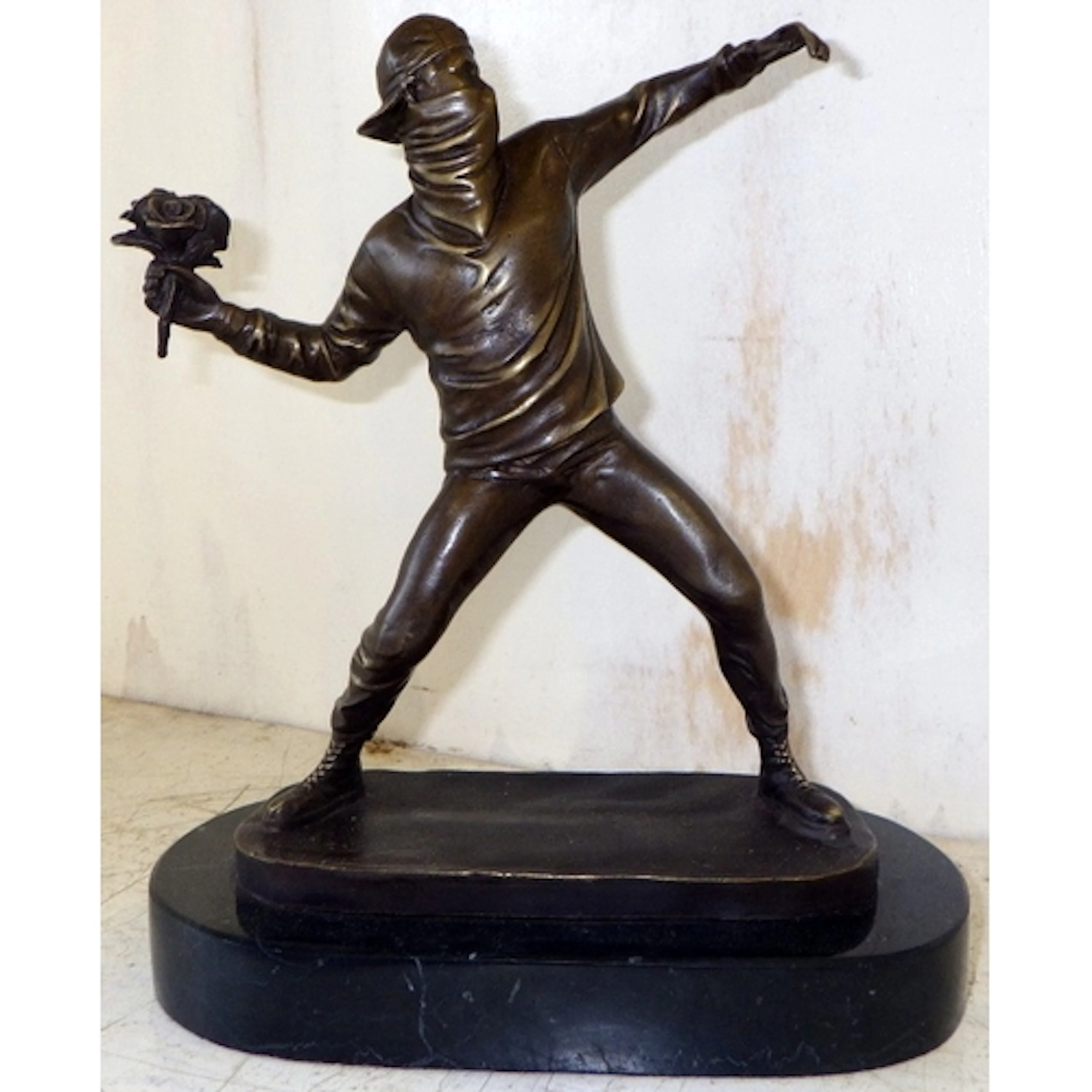After Banksy bronze Flower Thrower sculpture on marble base