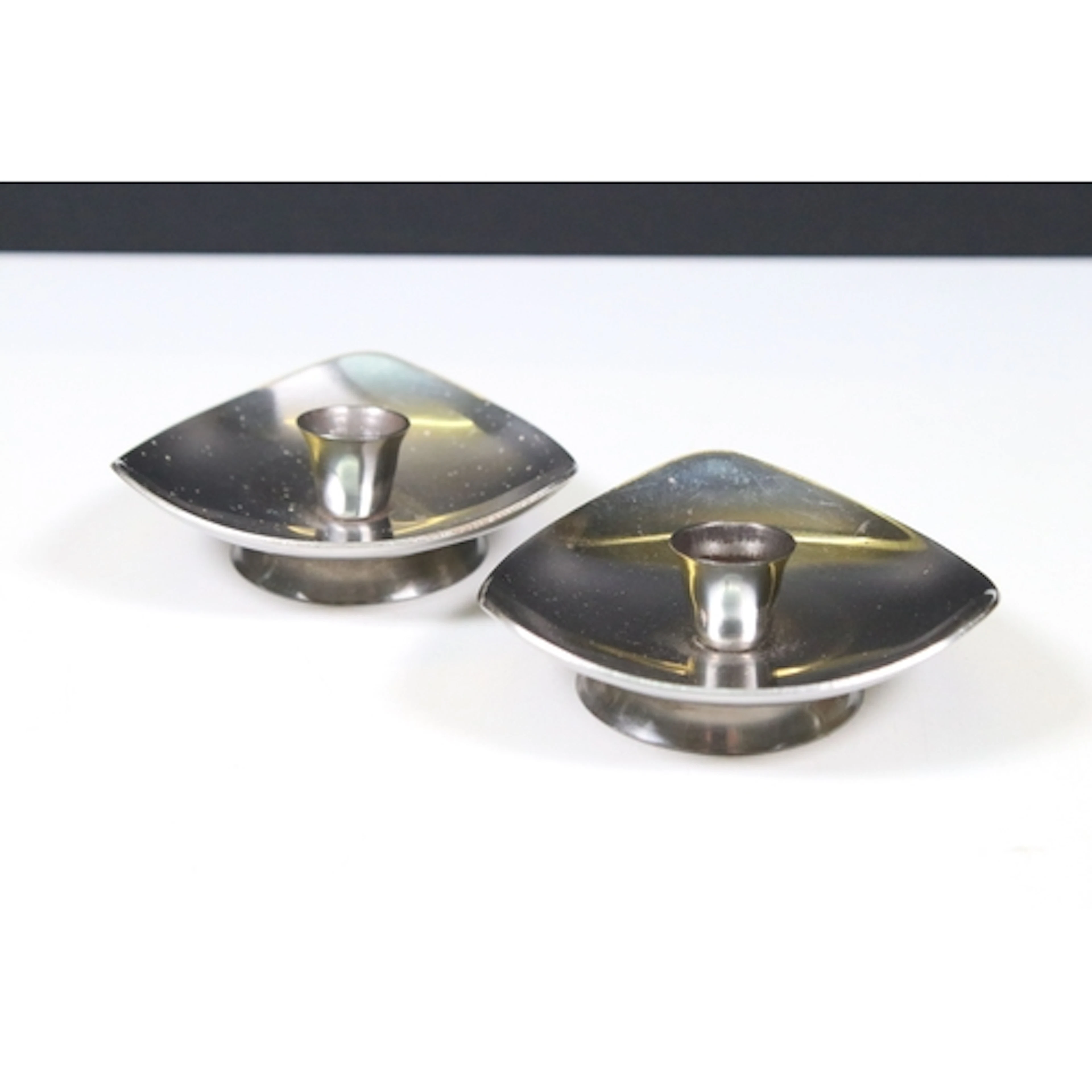 Pair of Mid-century Danish Stelton stainless steel candlesti...