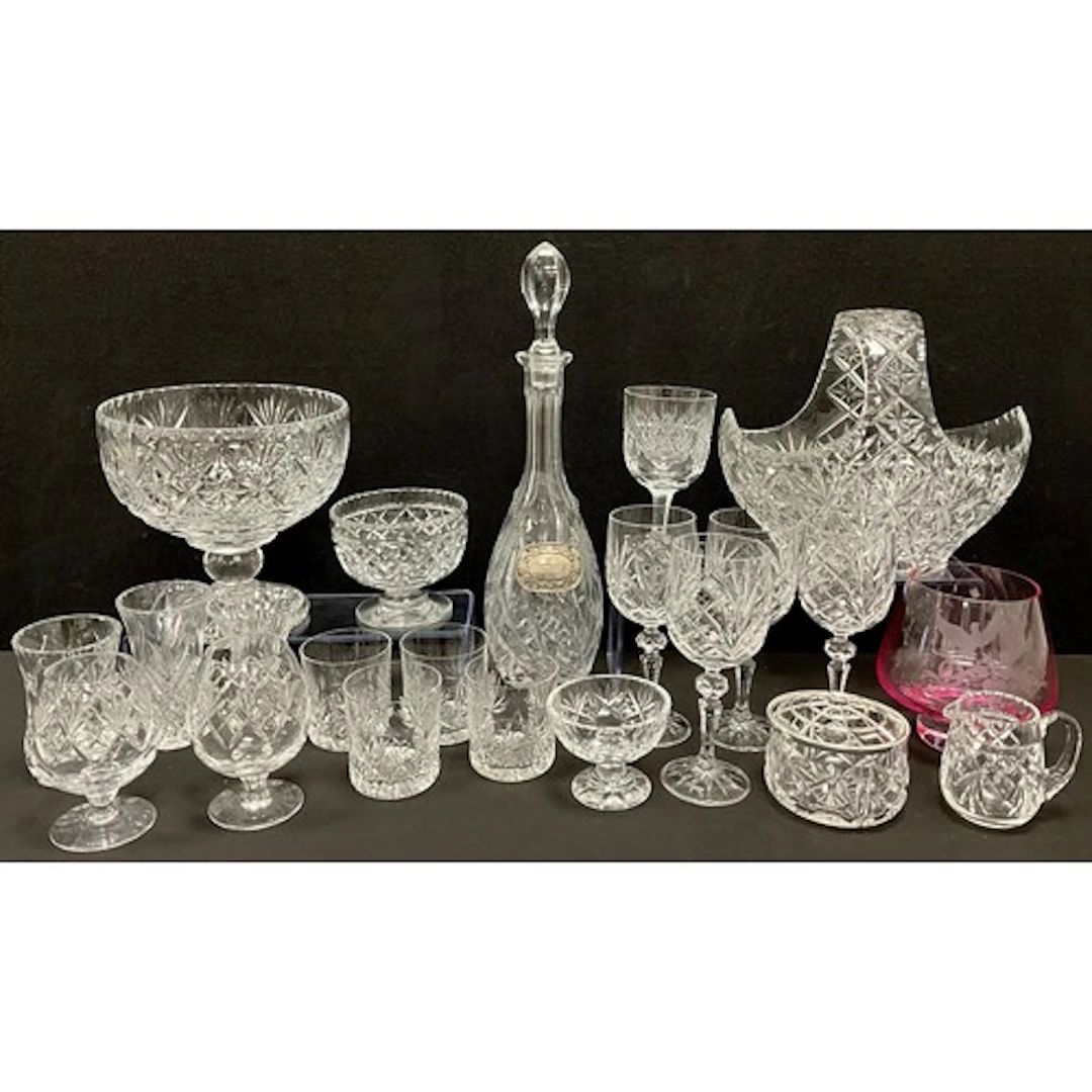 Glass - am elongated glass decanter, cut with sunflower moti...