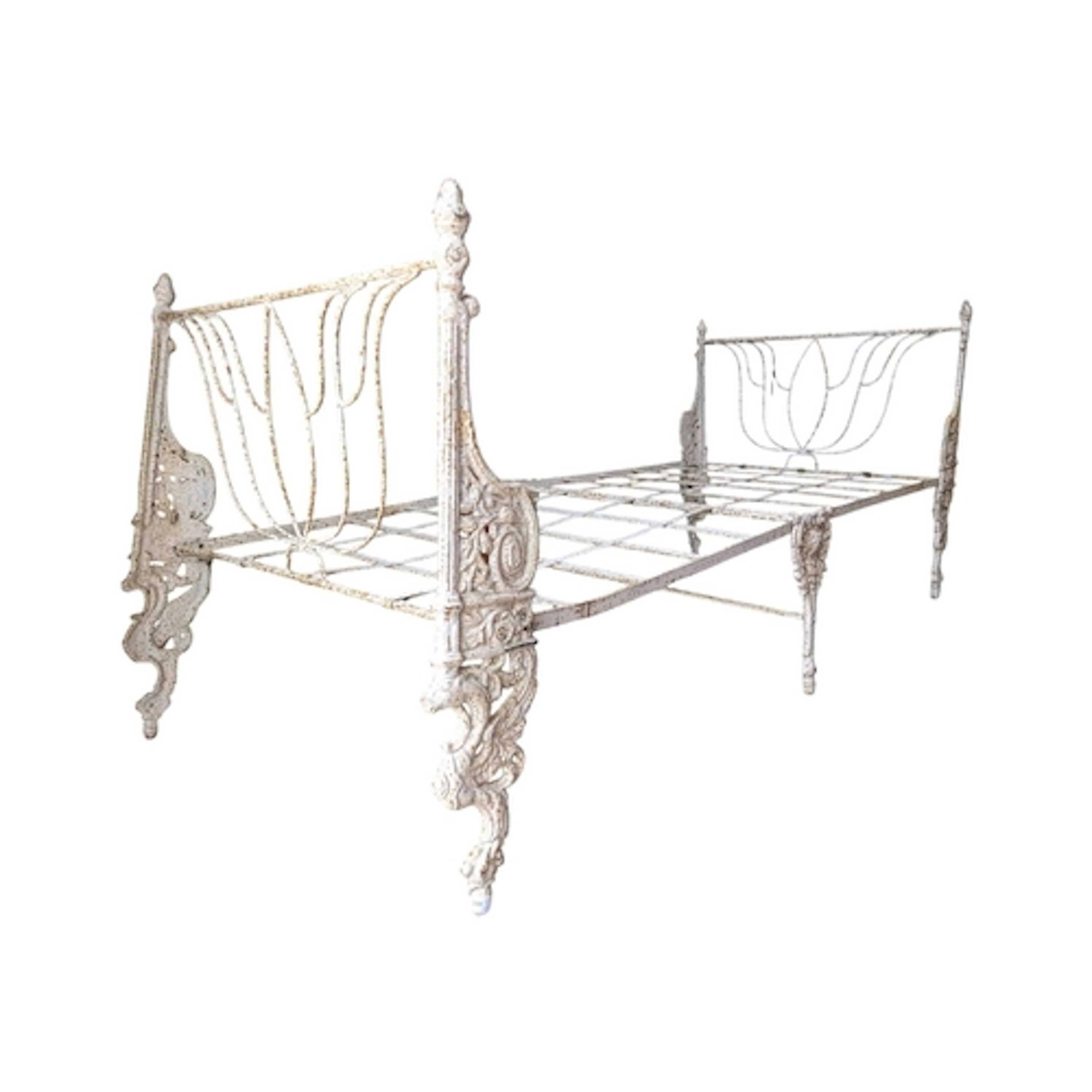 A 19th century Victorian cast iron day bed. The bed having w...