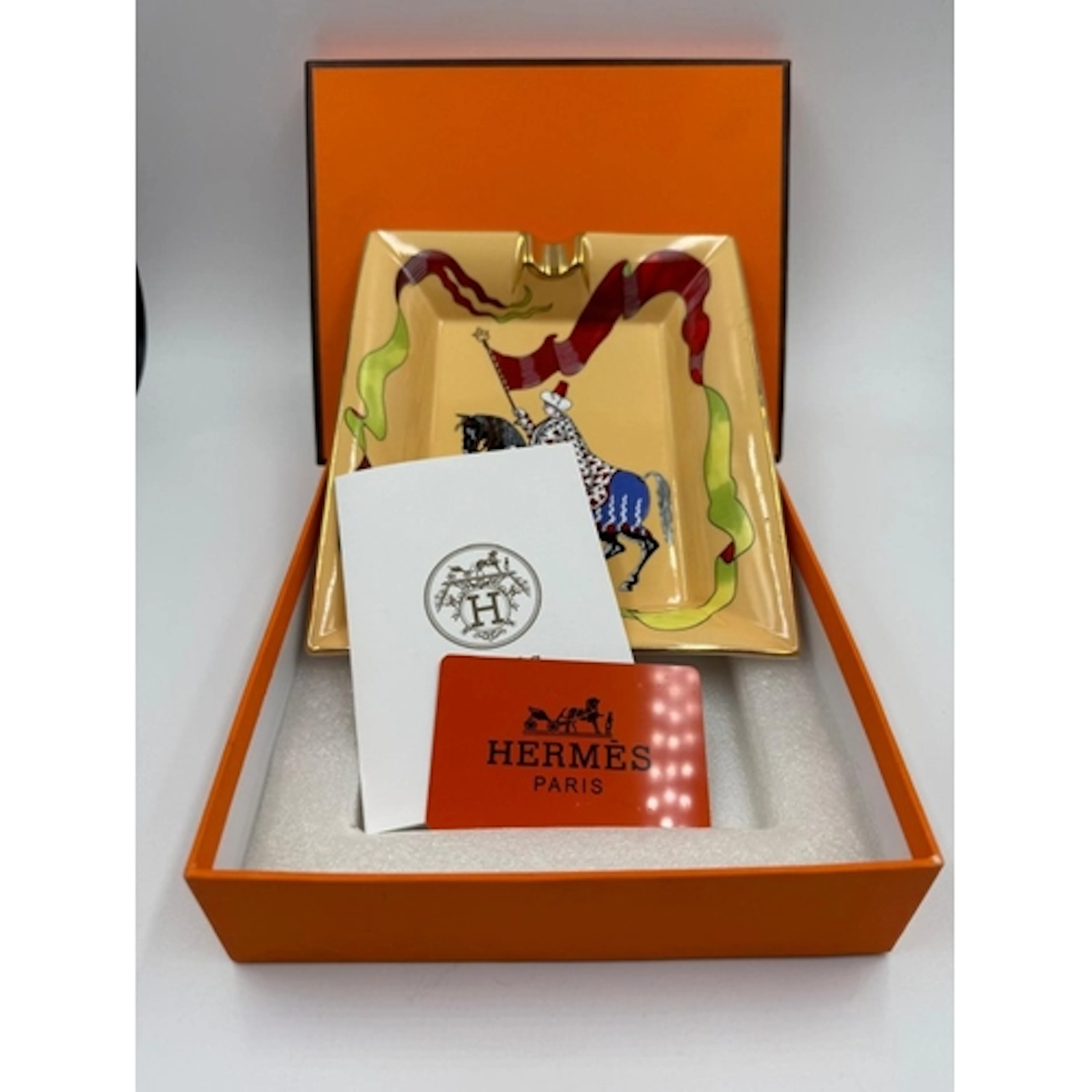 A Hermes "catch all" ashtray in the horse rider pattern, box...