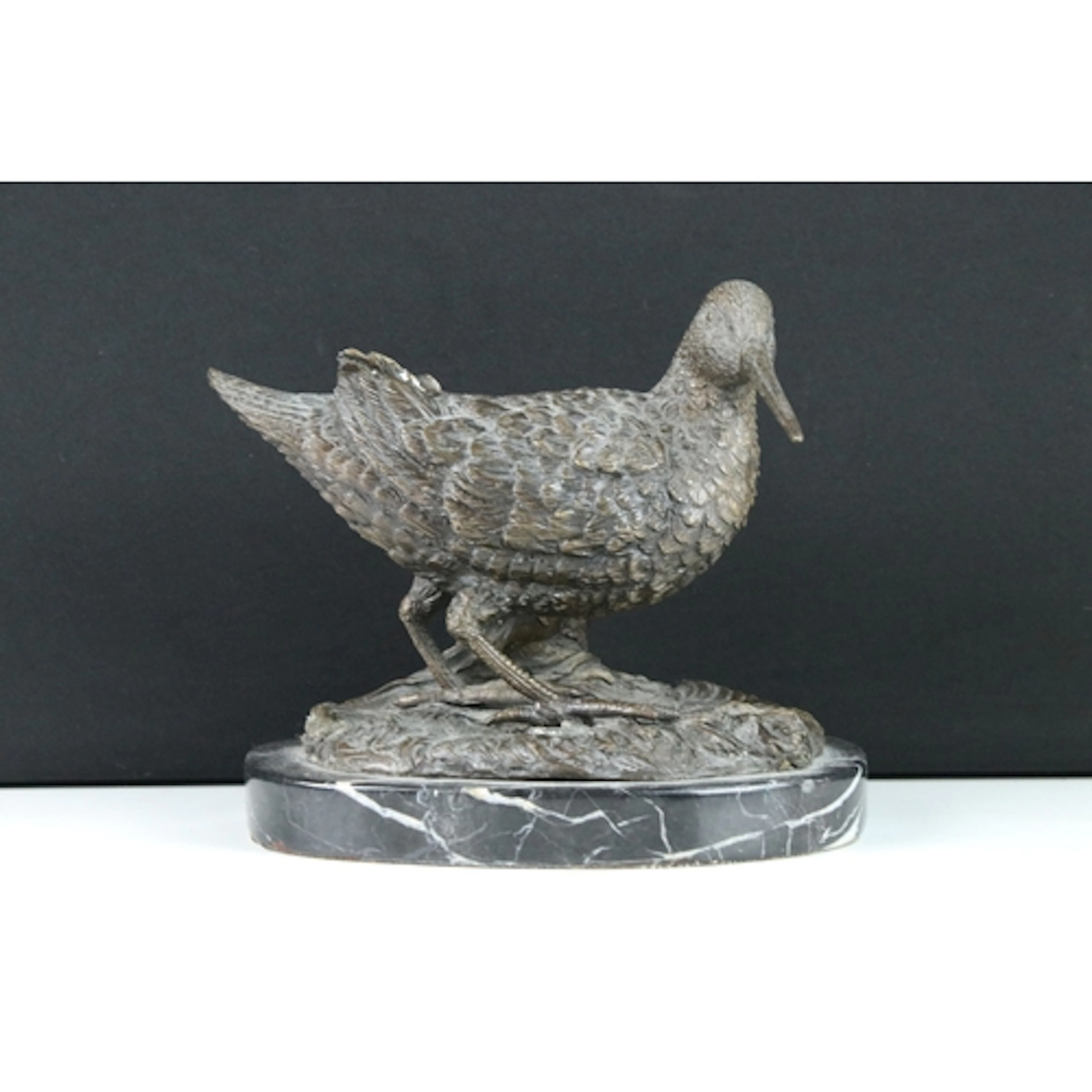 20th century bronze figure of a snipe on oval marble base, 1...