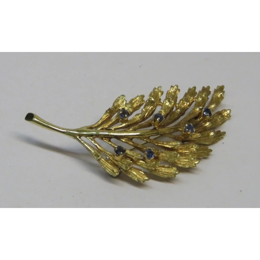 18ct Gold and sapphire set leaf form brooch, 5cm wide approx...