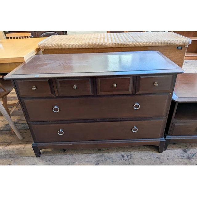 A Stag Minstrel mahogany low chest fitted two long and four ...