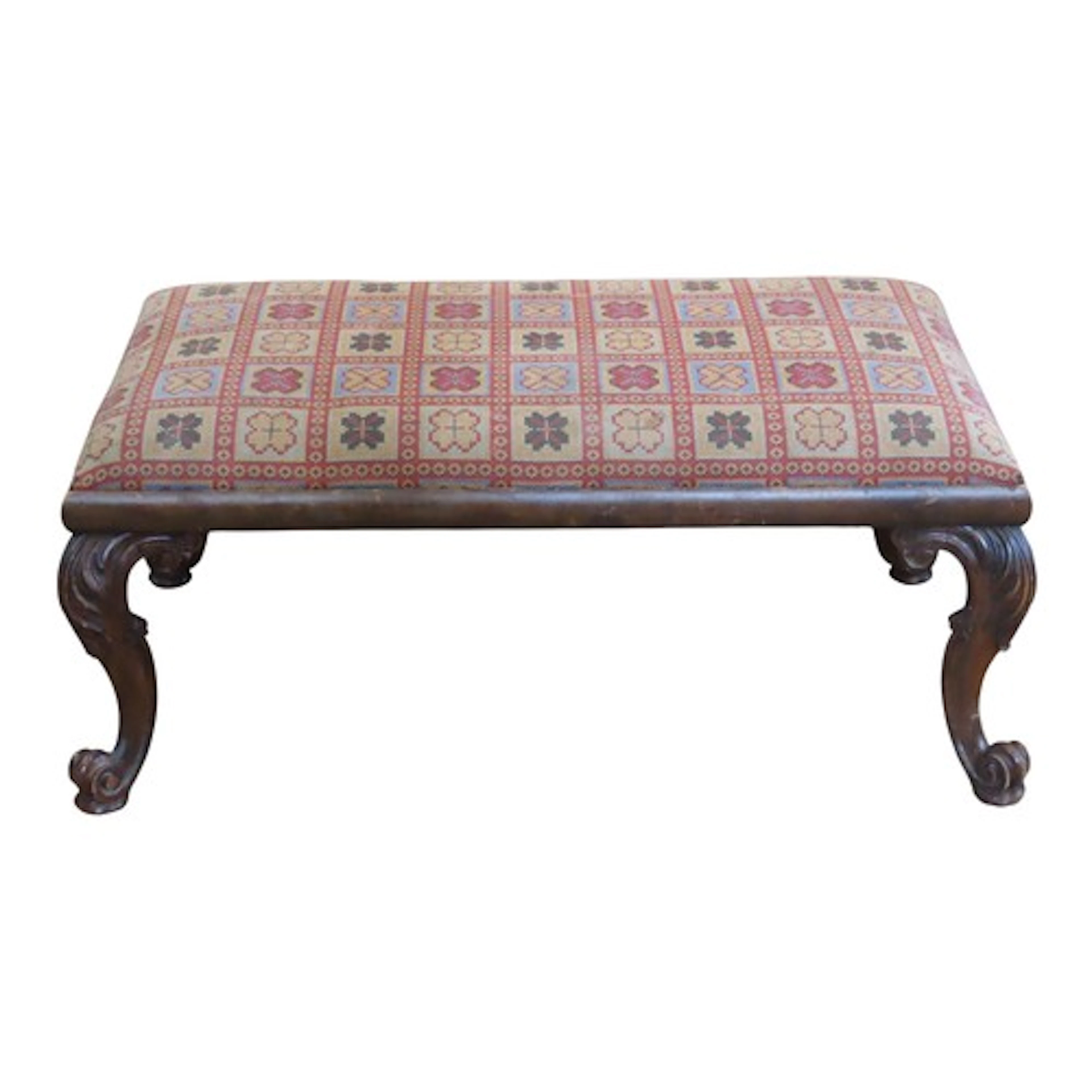 A rectangular stool with floral tapestry style upholstered d...