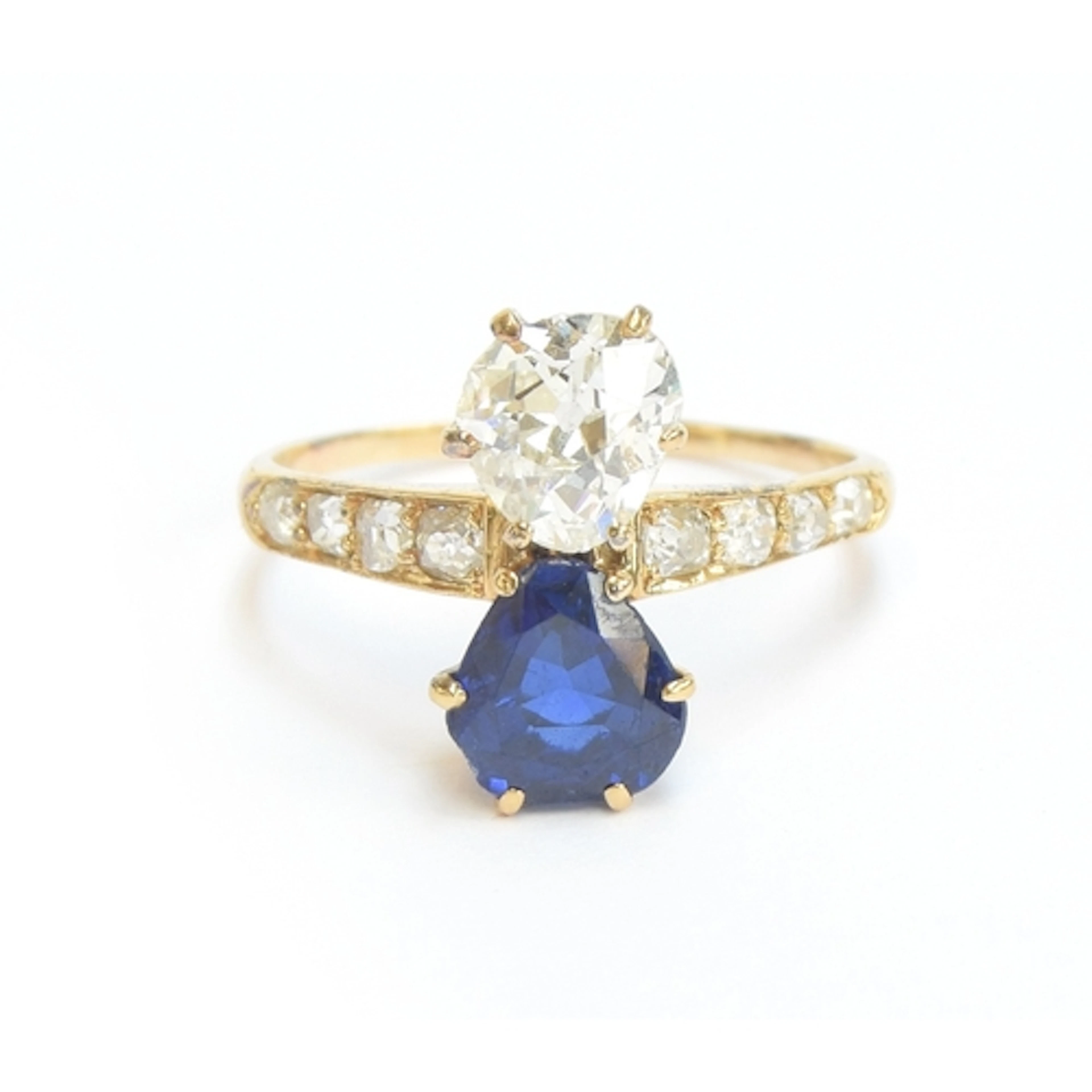 An Edwardian 18ct gold, sapphire and diamond Toi et Moi ring...