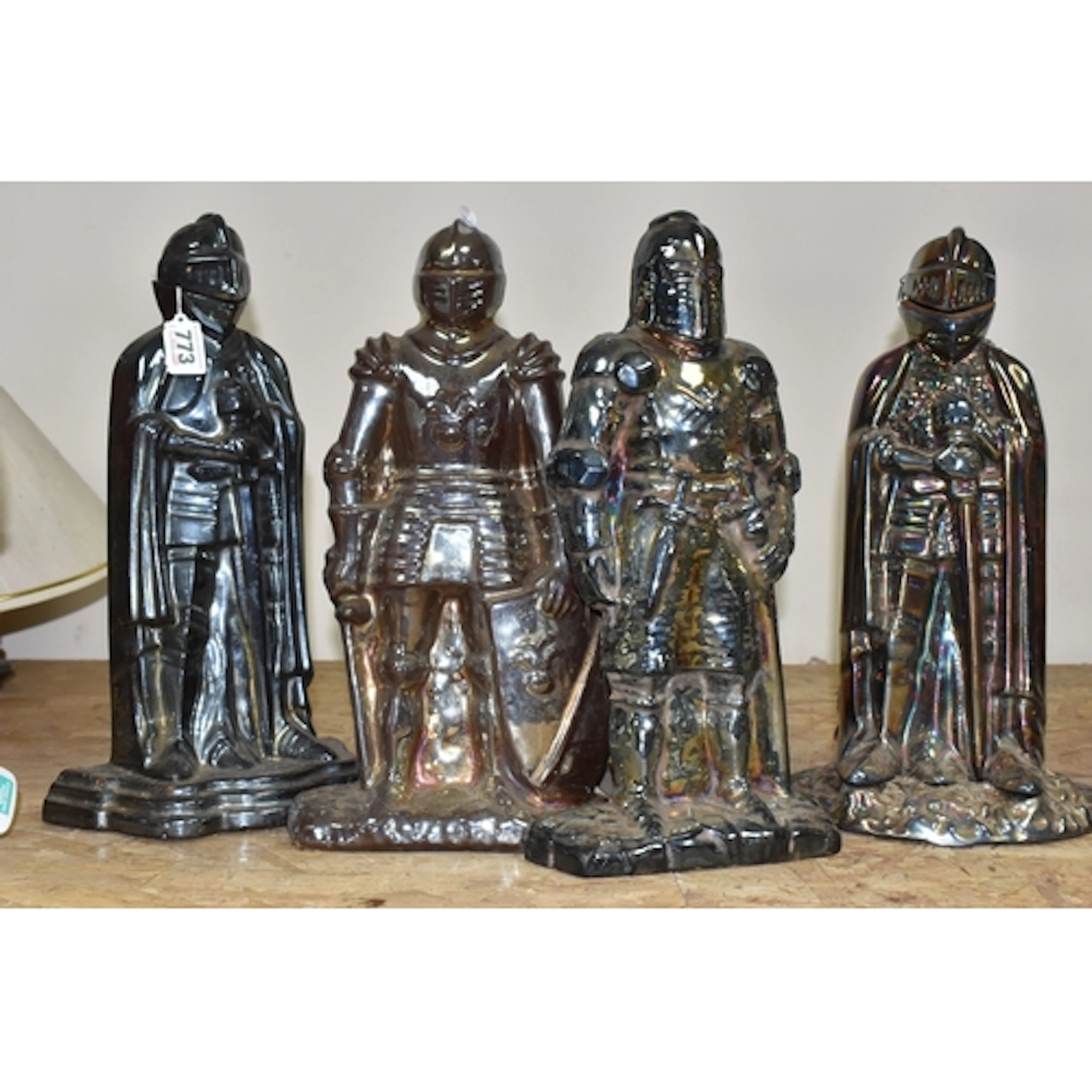 FOUR LUSTRED FIGURAL COMPANION SETS in the form of medieval ...