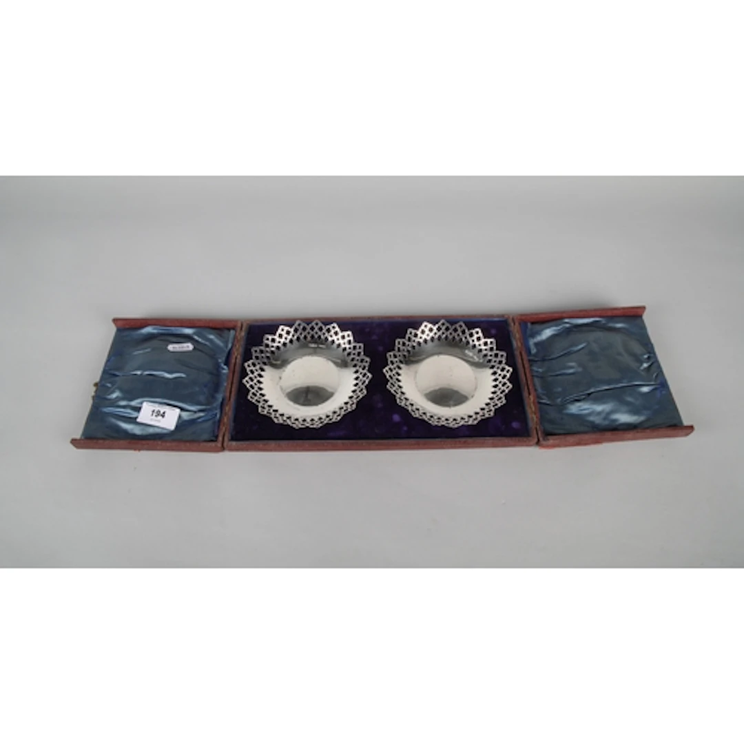 Two silver Pierced bon bon dishes in fitted case, Chester 19...