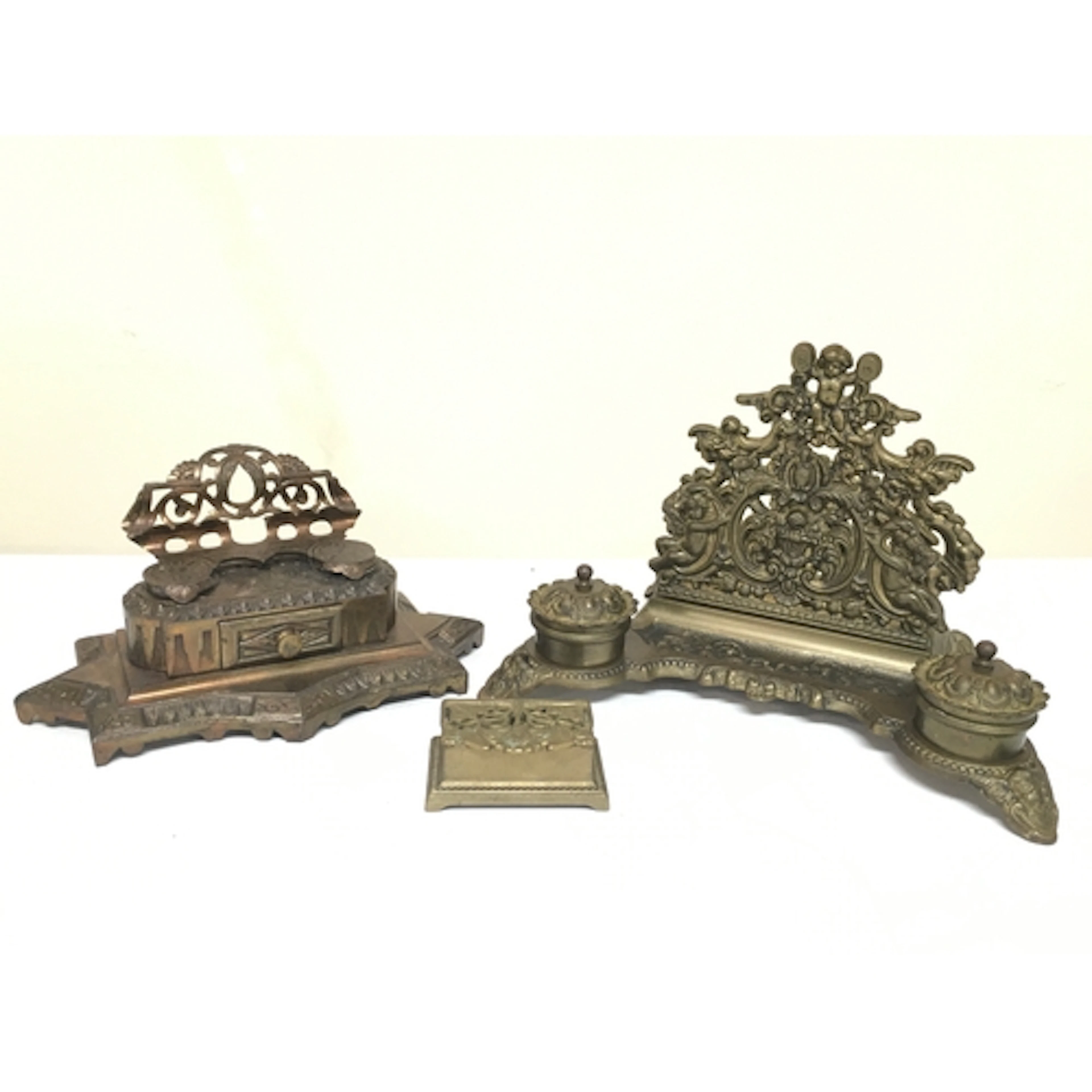 Two Brass desk sets featuring double inkwells and integrated...