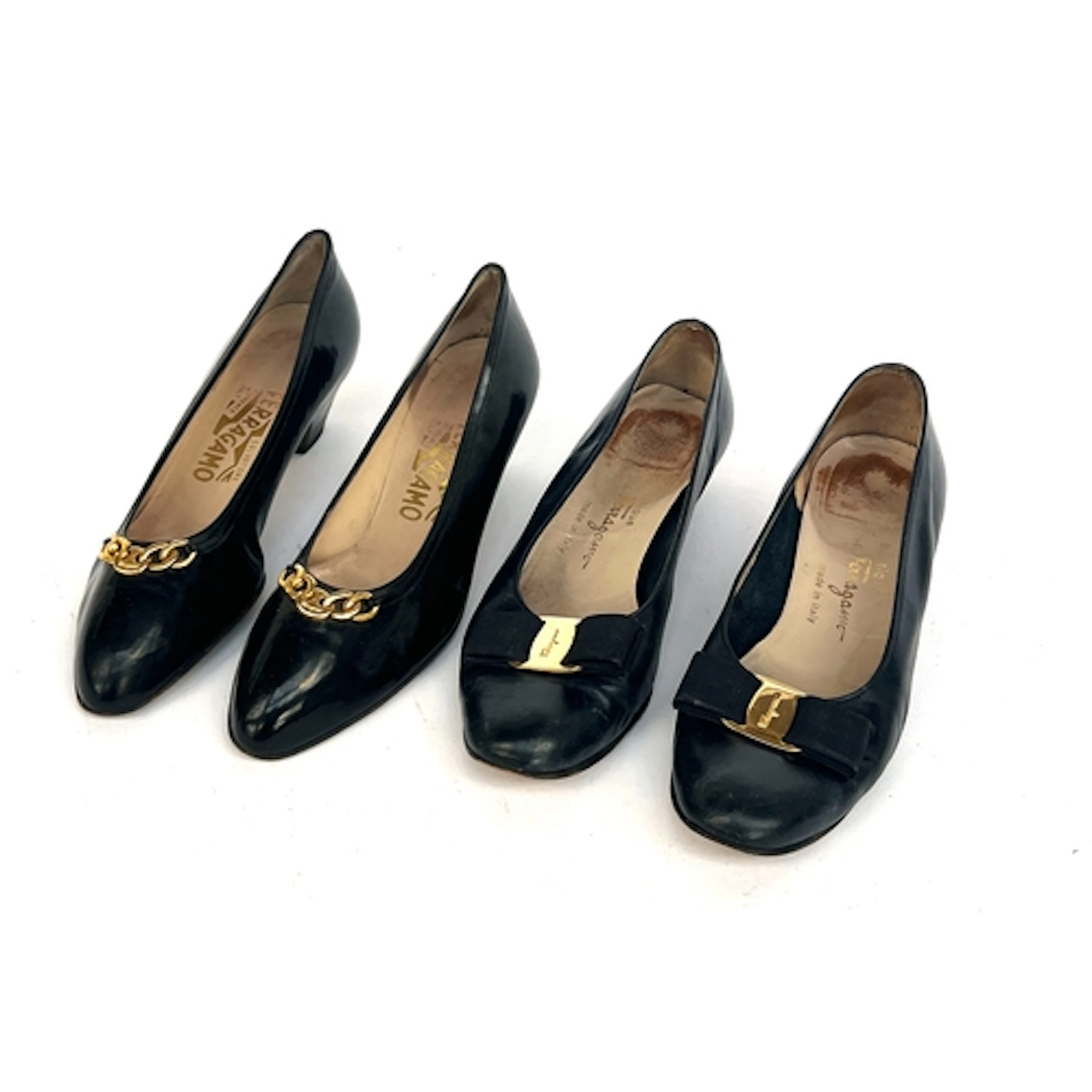 Two pair of Ferragamo black leather heeled pumps, one pair p...