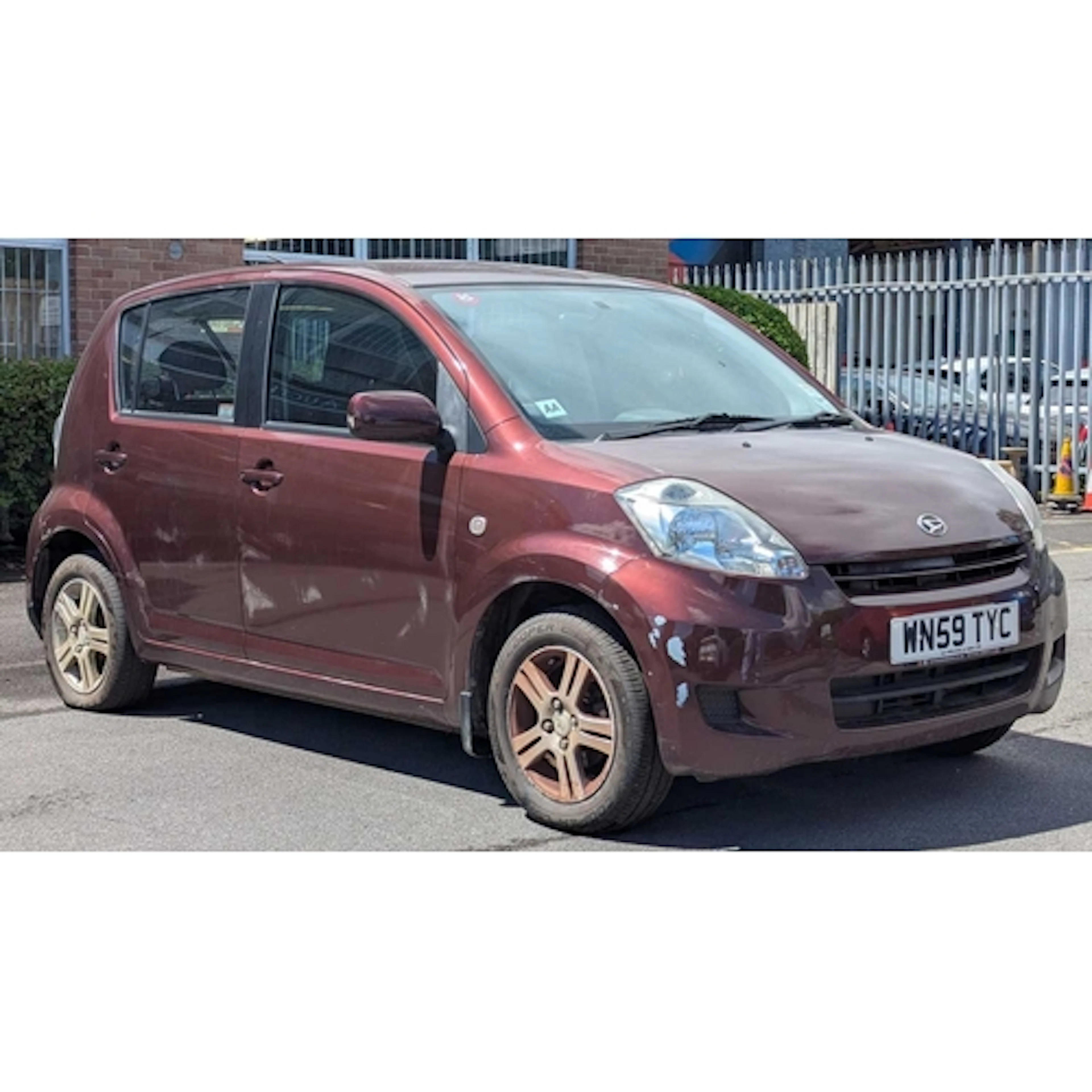WN59 TYC - 2009 Daihatsu Sirion SE hatchback in metallic bur...