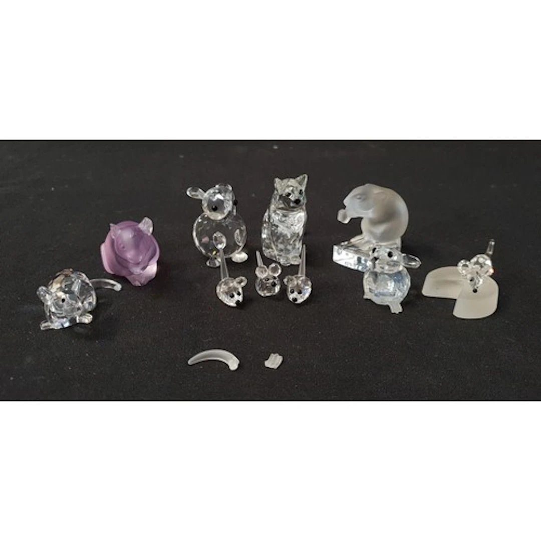 FOUR SWAROVSKI CRYSTAL ANIMAL FIGURINES comprising Swarovski...