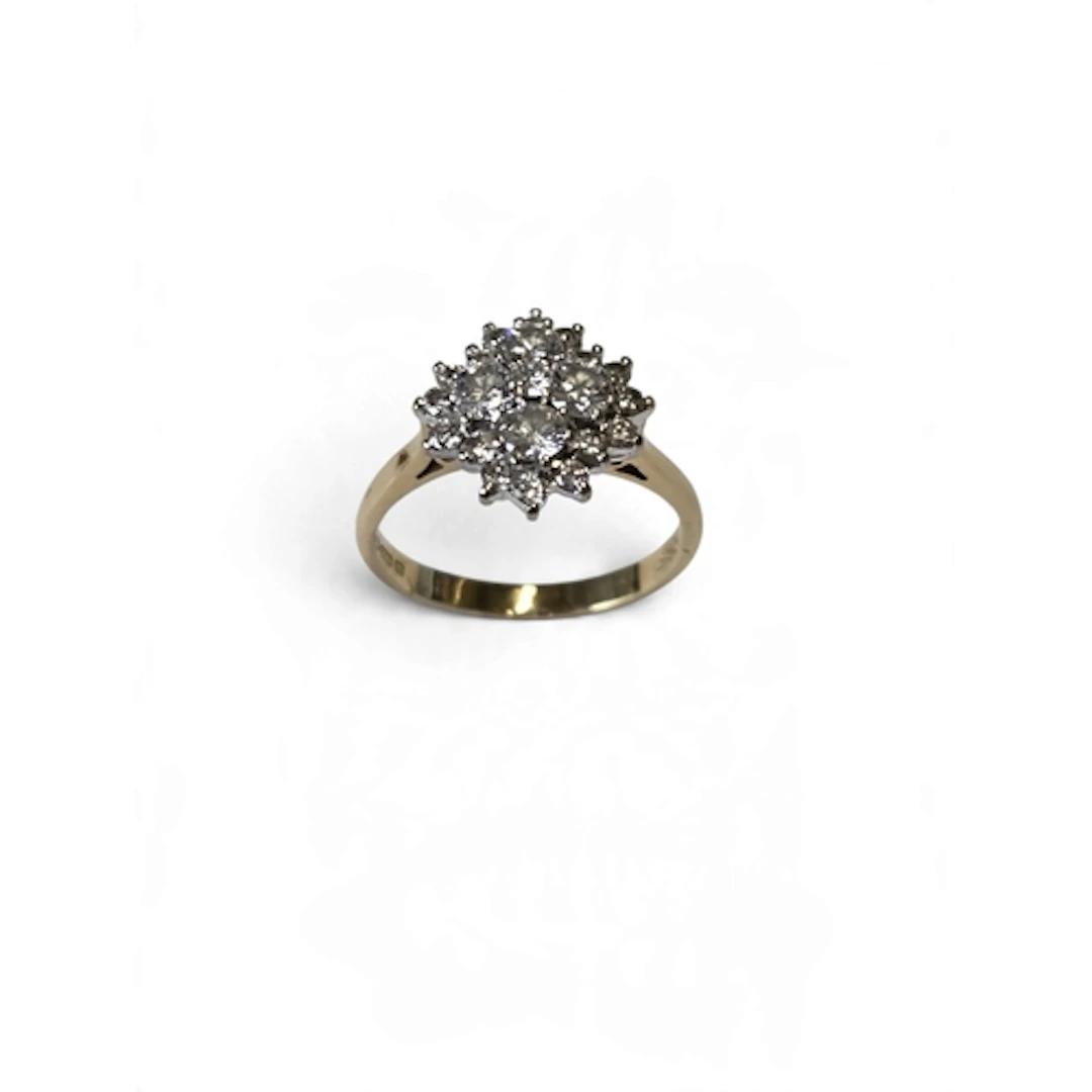 A fantastic 18-carat gold diamond cluster ring, centred with...