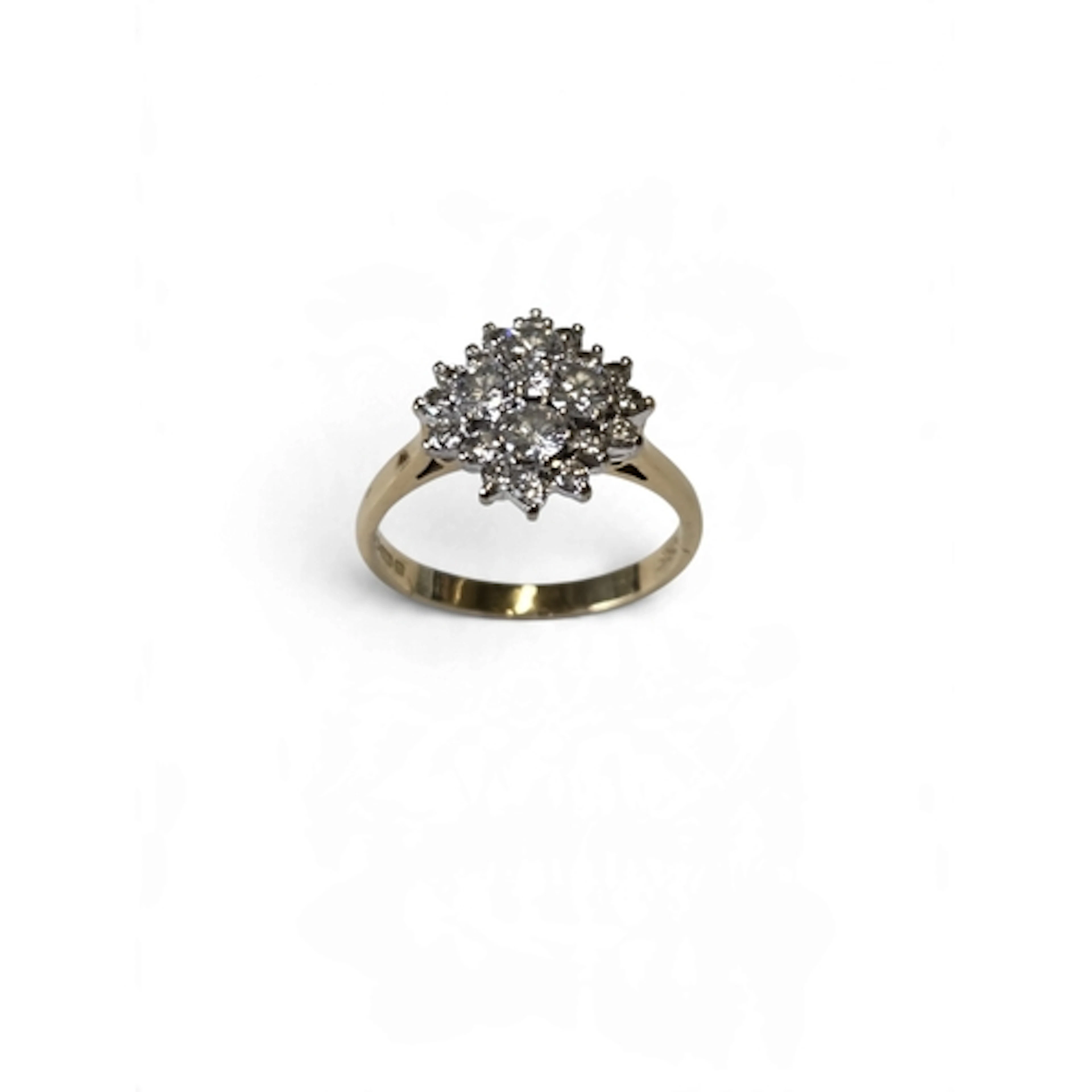 A fantastic 18-carat gold diamond cluster ring, centred with...