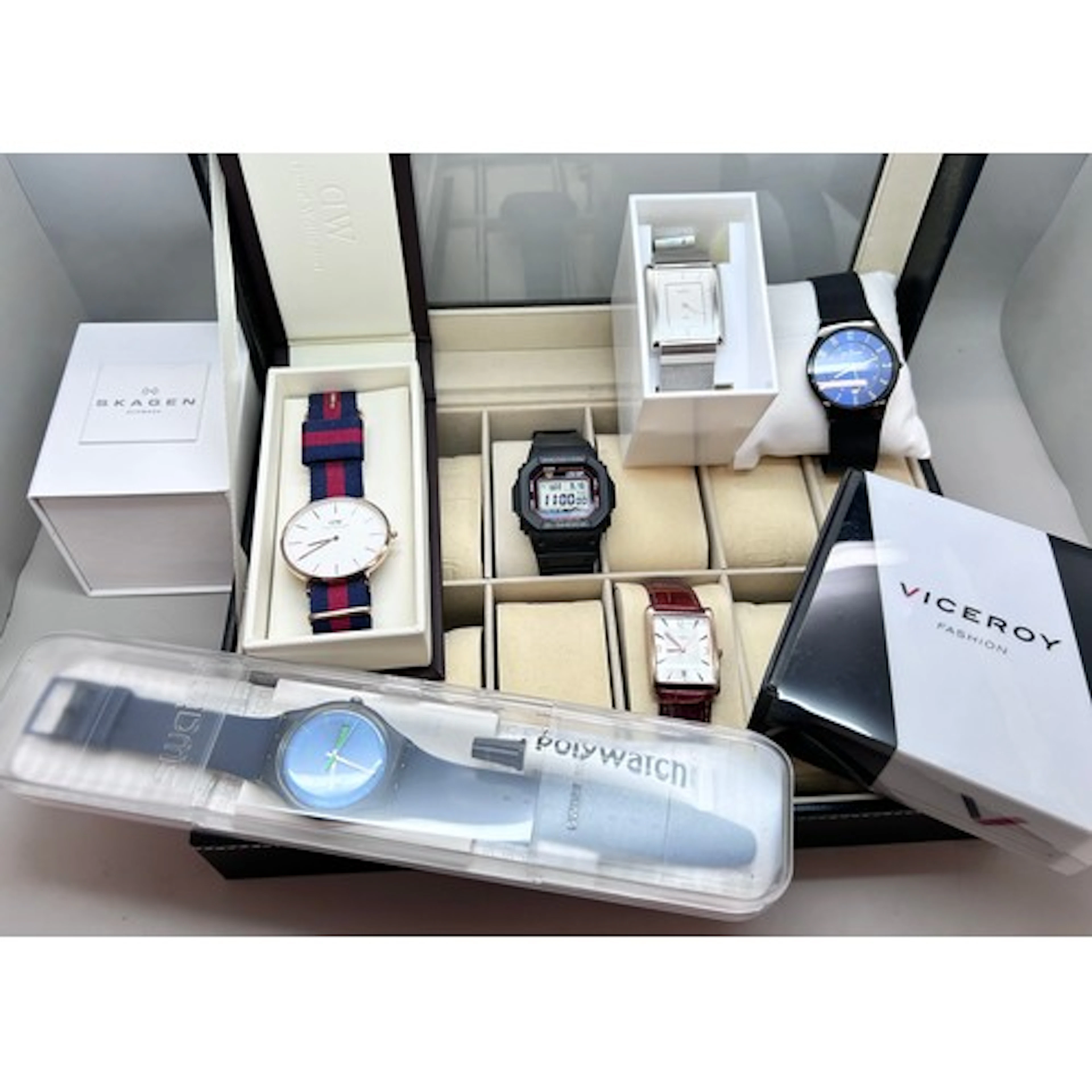 A collection of wristwatches including Swatch, Daniel Wellin...