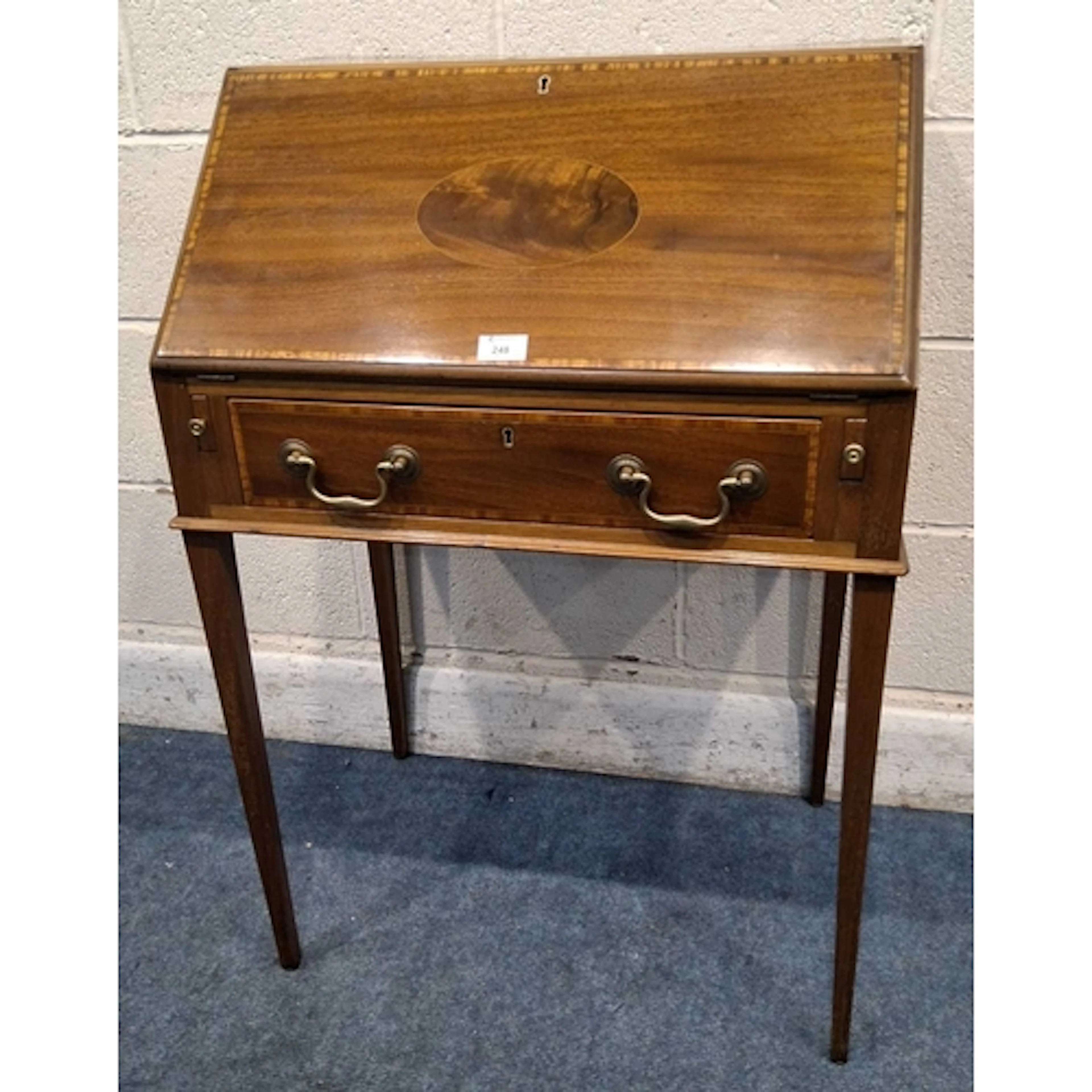 A REPRODUCTION BUREAU, the fall front door enclosing a fitte...