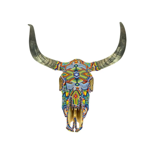 A Mexican beaded steer Skull. Heavily decorated with applied...