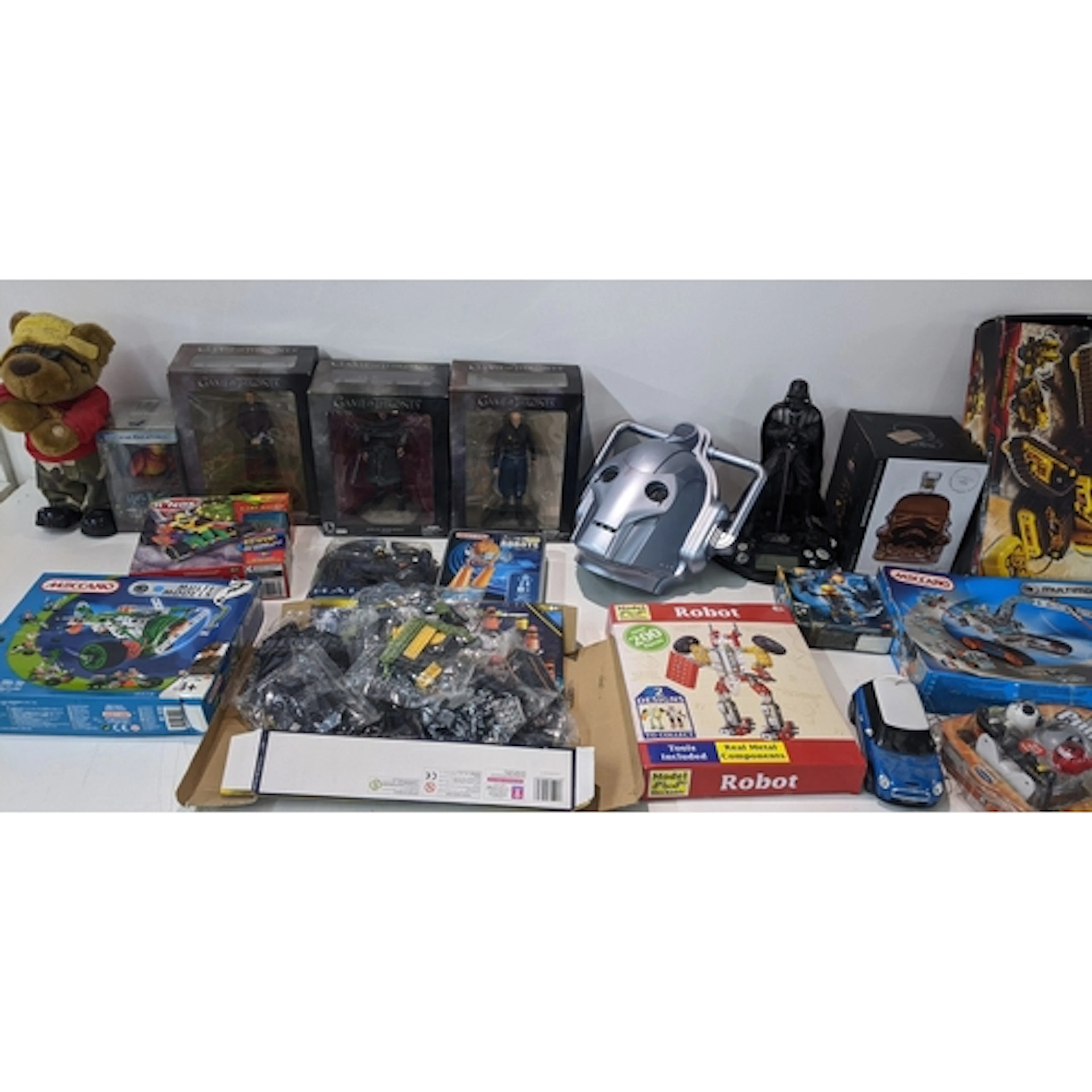 A mixed lot of toys and figures to include K'nex, Meccano, G...