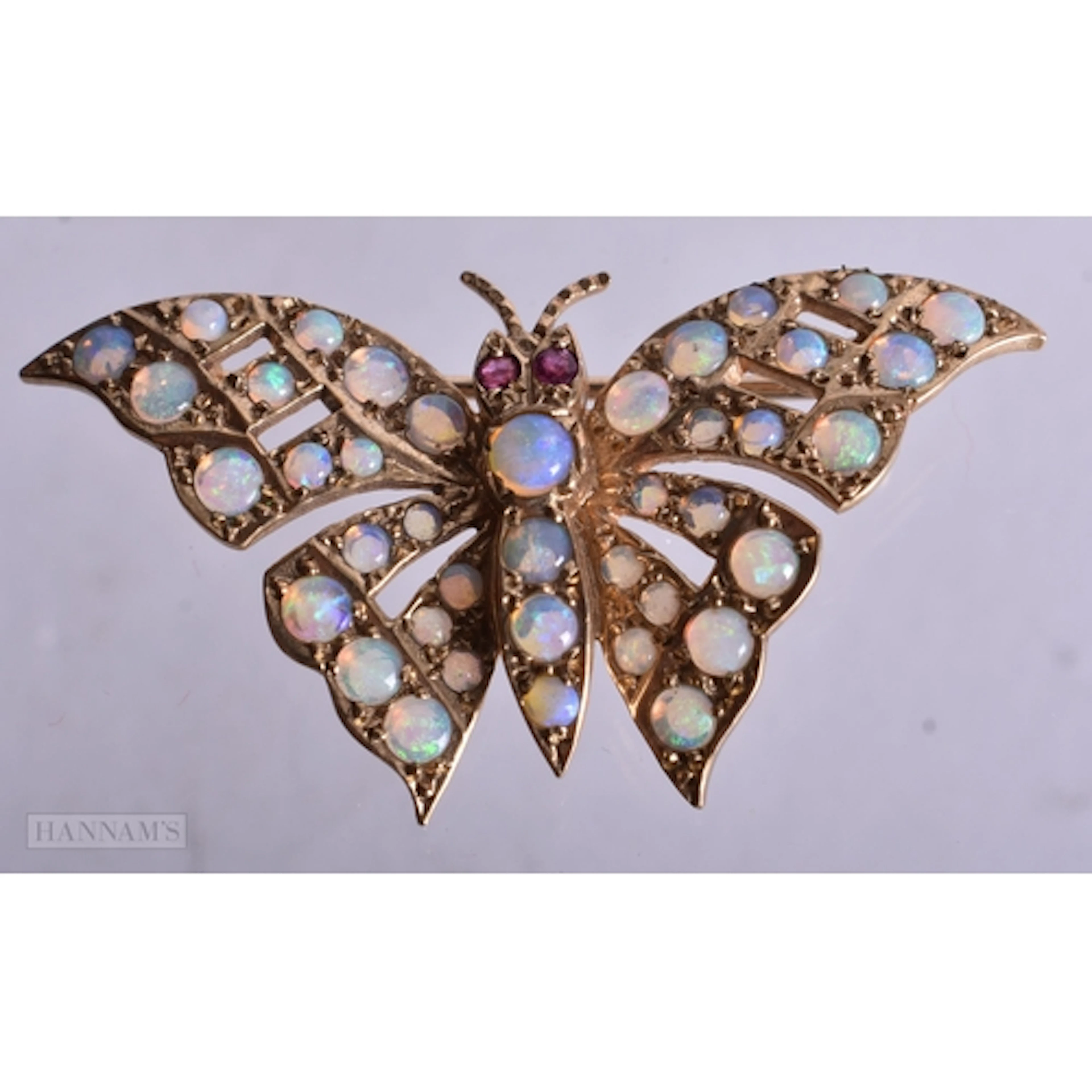 9ct gold opal and ruby butterfly brooch (5g). 4 cm x 2.25 cm...