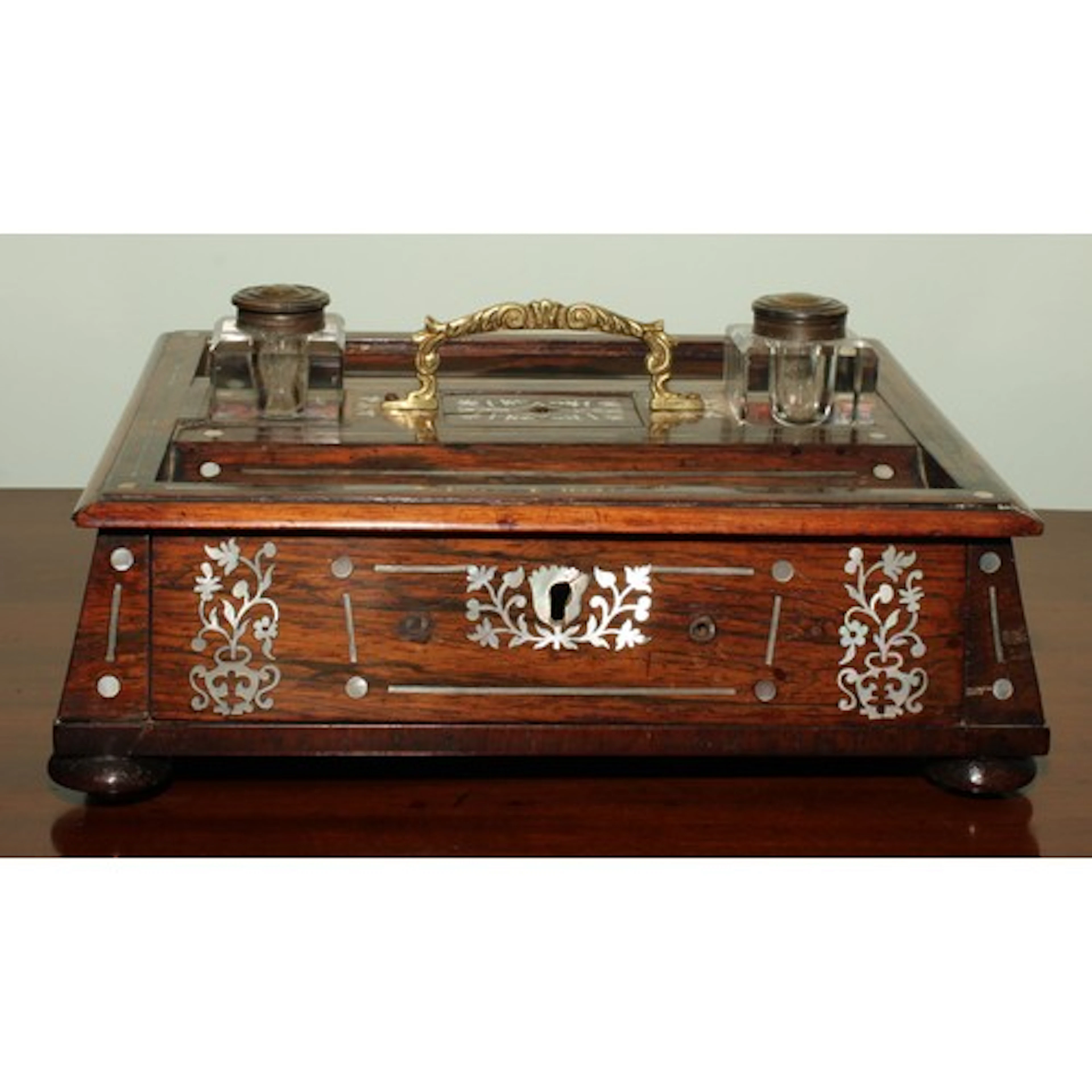 A George IV rosewood and mother of pearl marquetry sarcophag...