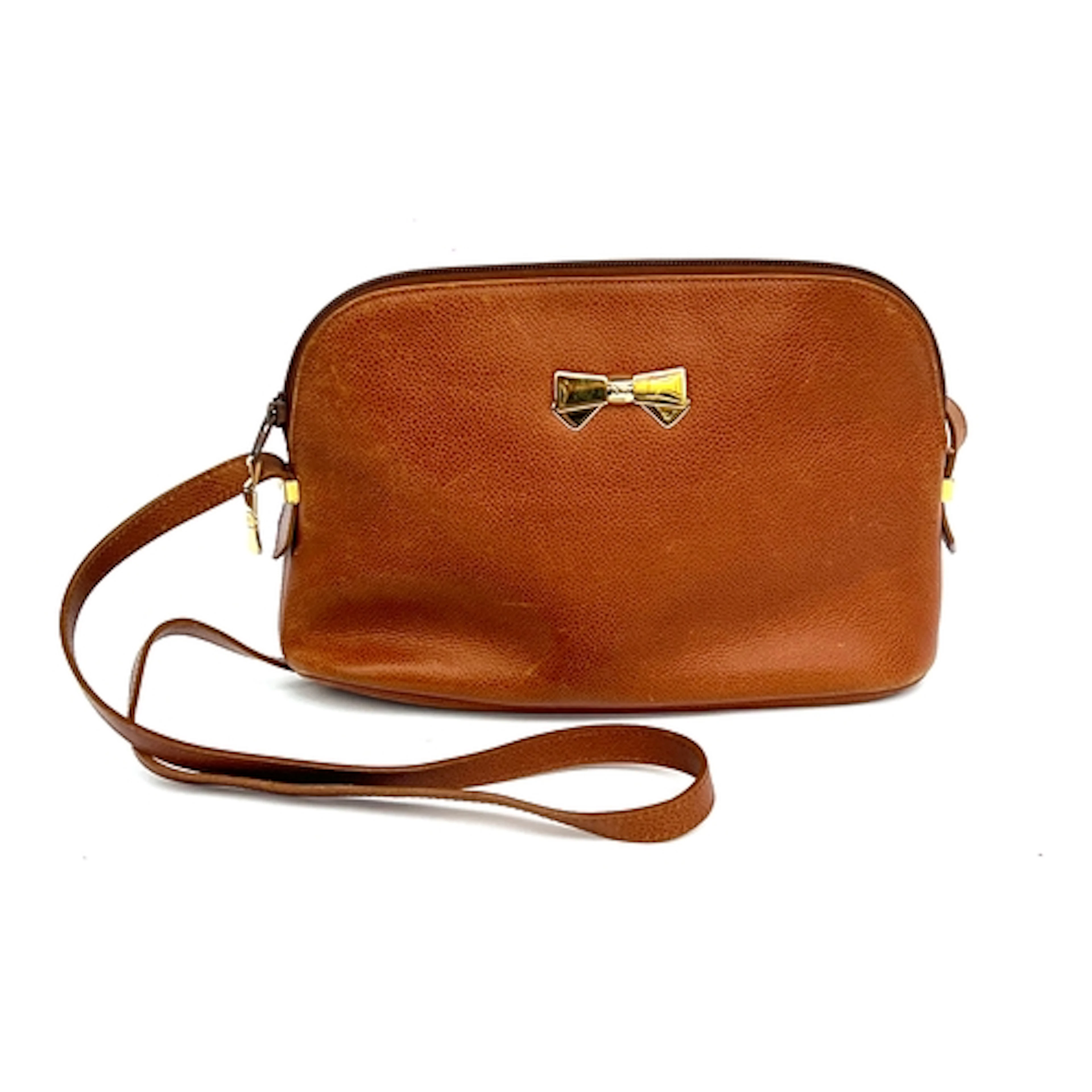 A Nina Ricci brown leather shoulder bag, with gold tone bow ...