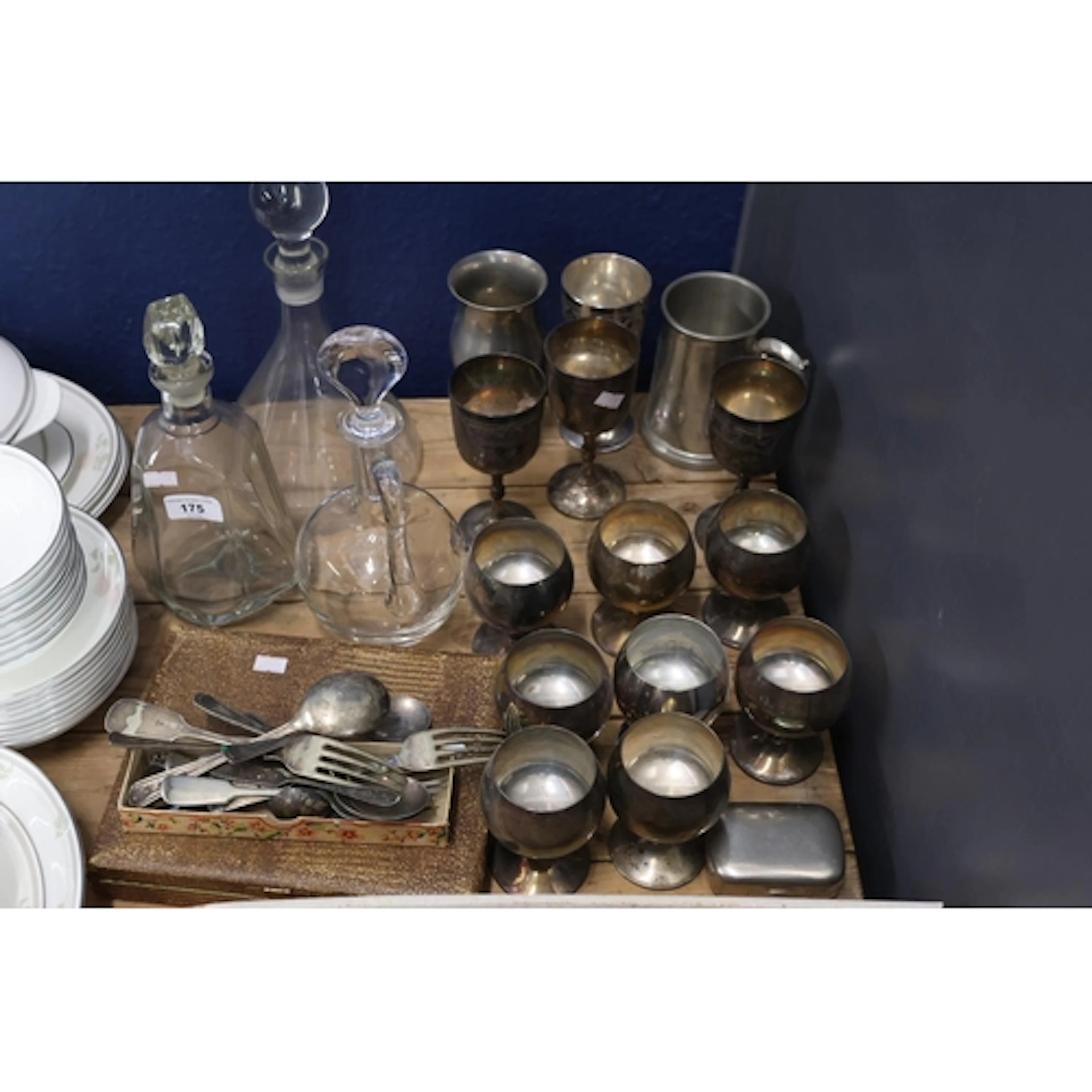 Glass decanters, EPNS goblets and tankards, along with flatw...
