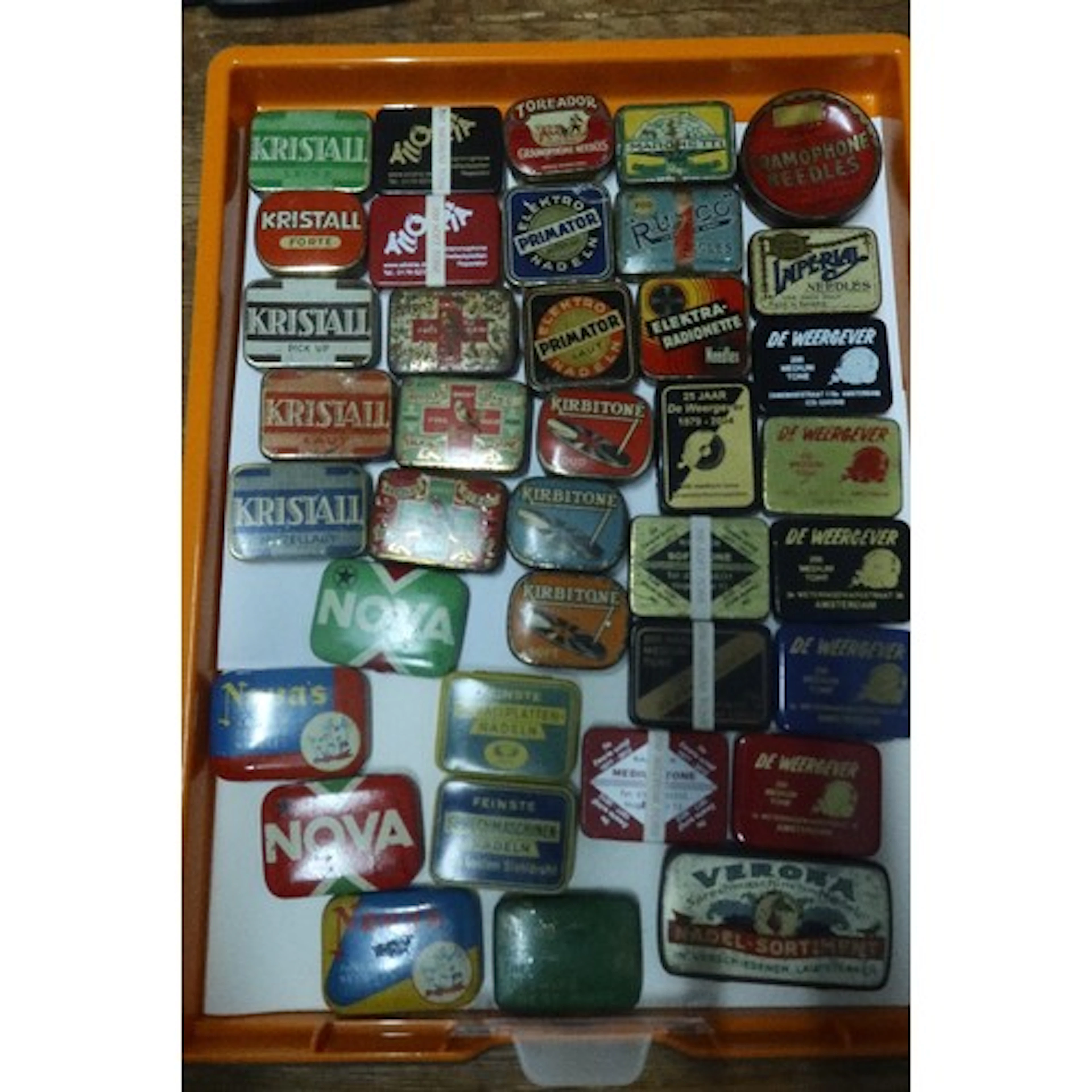 A tray of vintage gramphone needle tins
