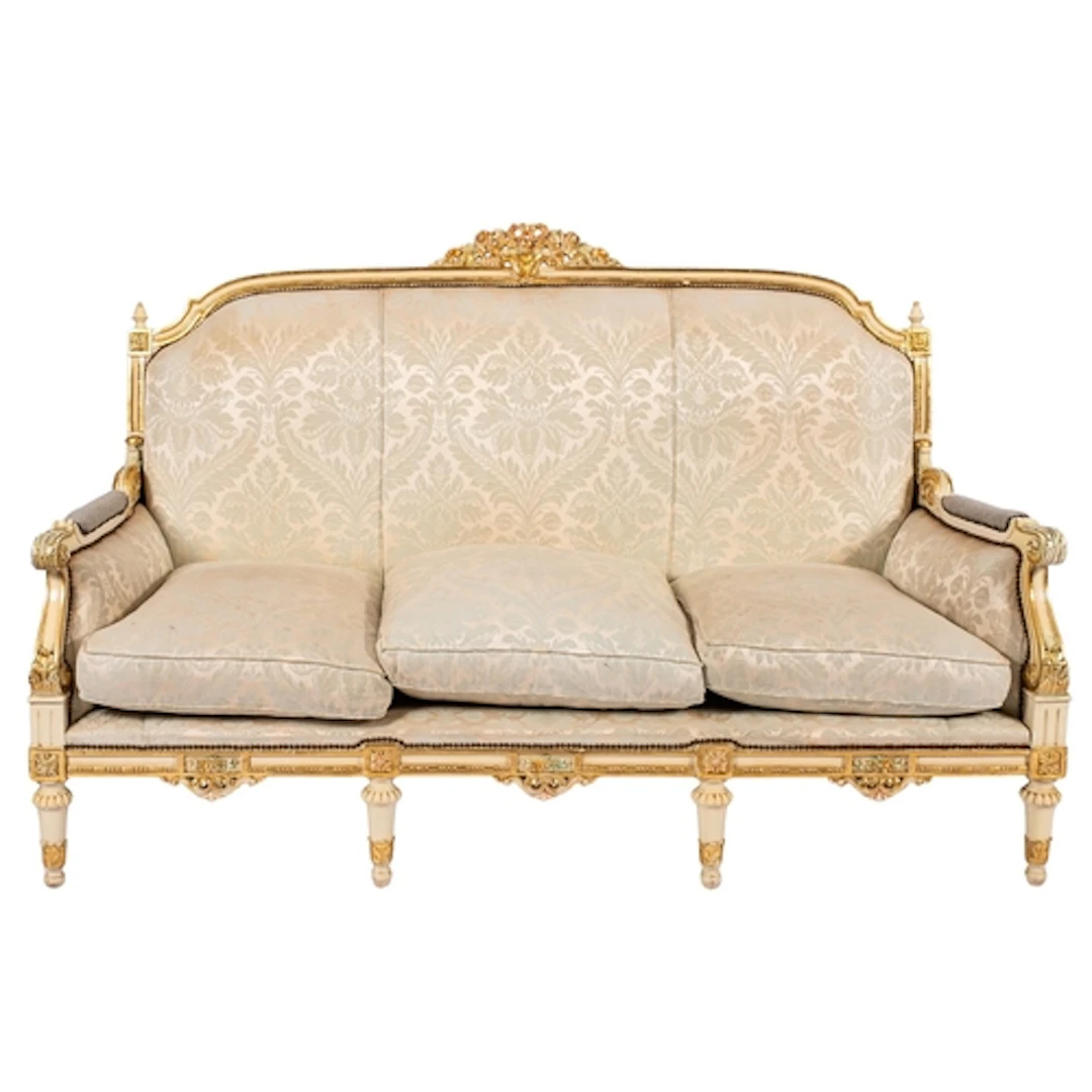 A pair of carved, painted and parcel giltwood sofas in Neapo...