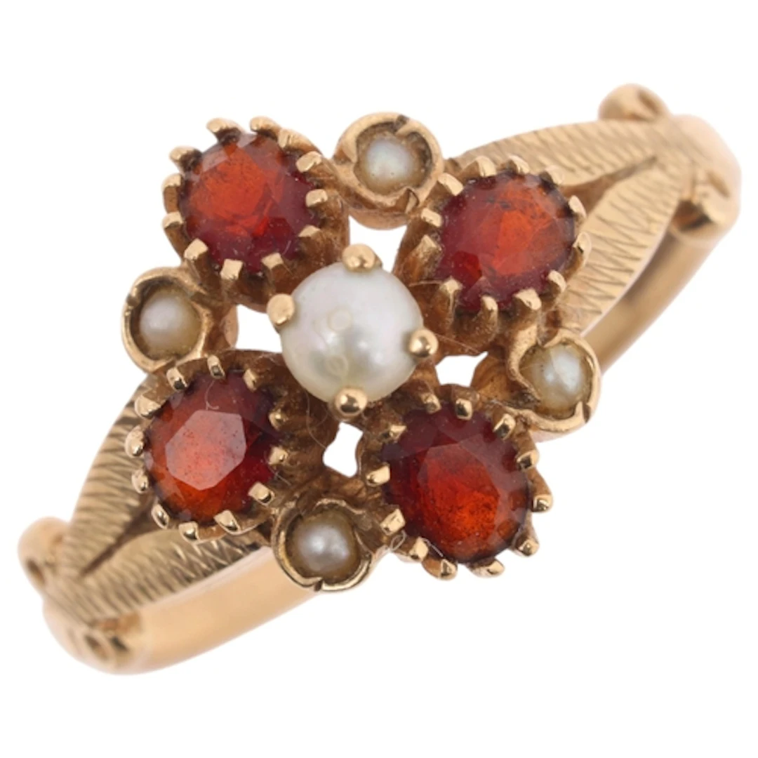 A 9ct gold garnet and pearl flowerhead ring, maker REM, Birm...
