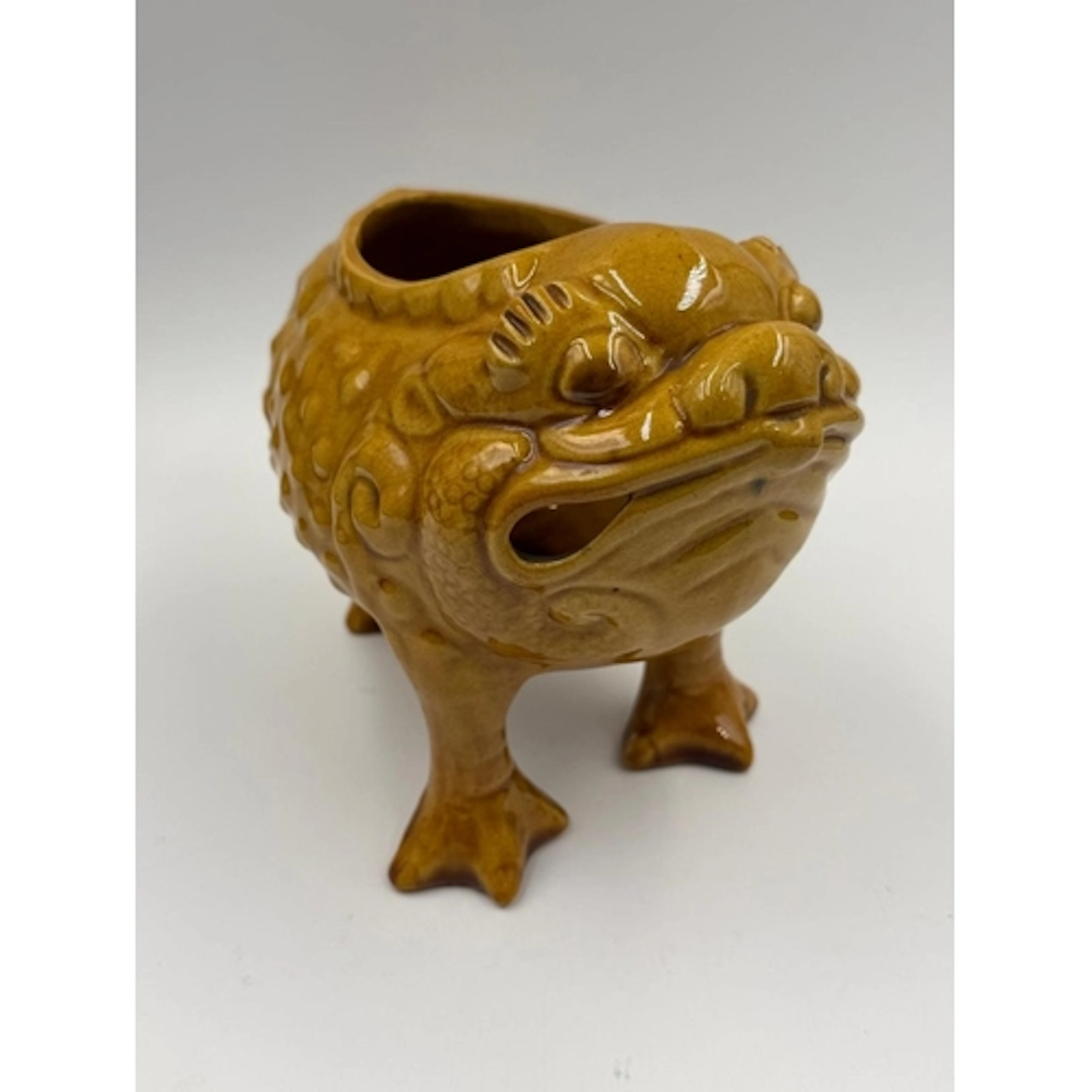 A Dunmore pottery grotesque frog or toad in mustard, makers ...