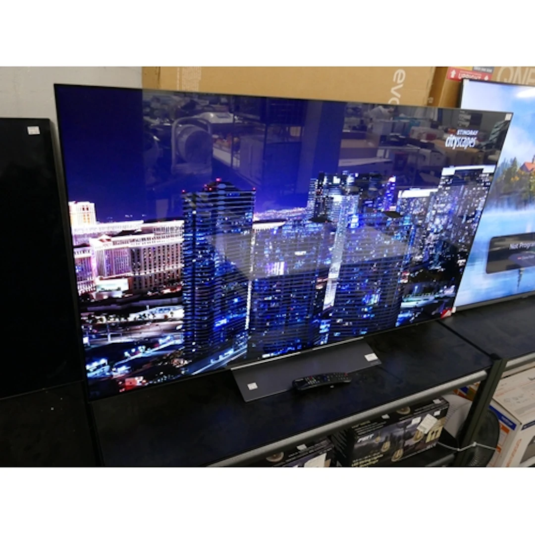 A LG 55" OLED 4K UHD Television with remote, original RRP £9...