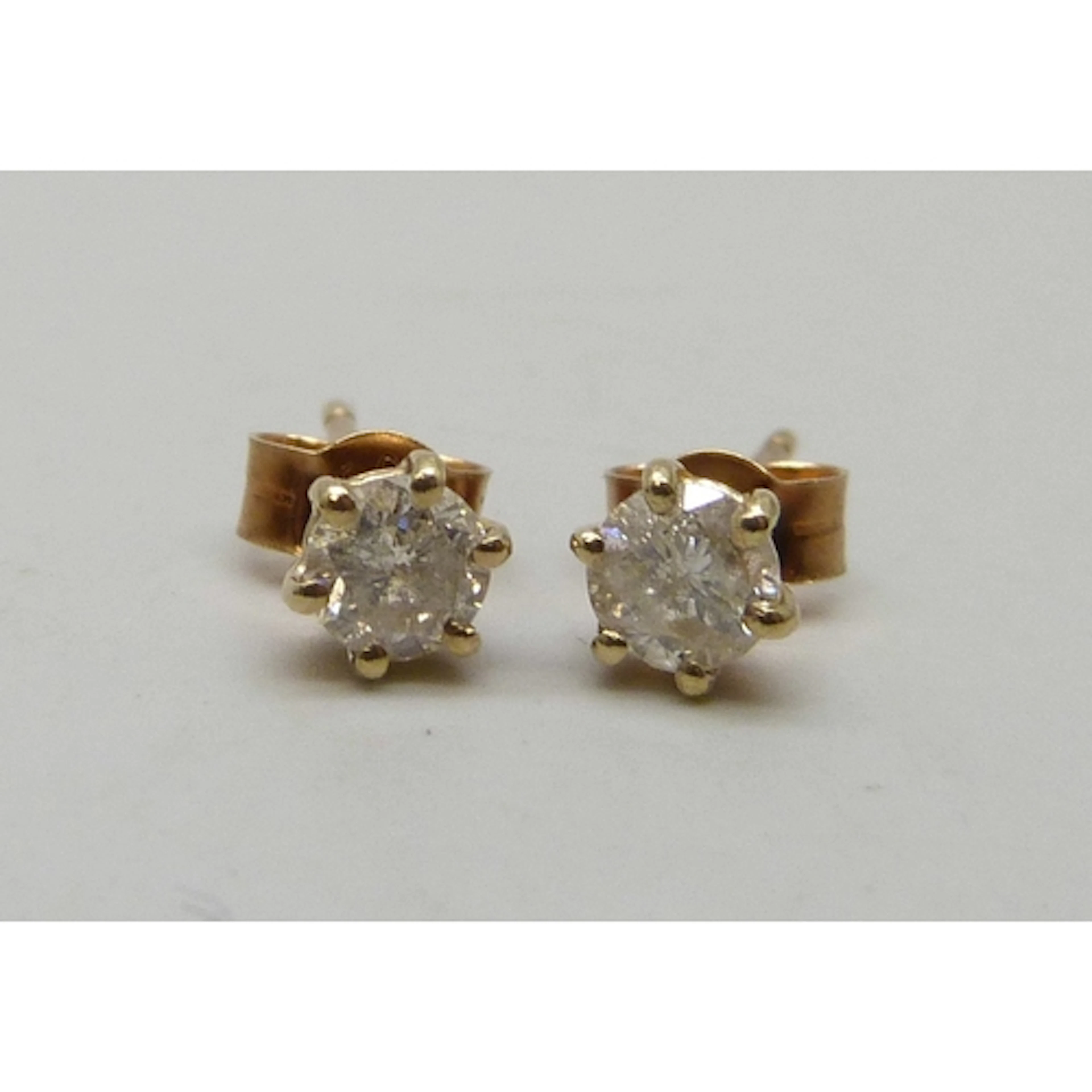A pair of 9ct gold diamond stud earrings, 0.7g, approximatel...