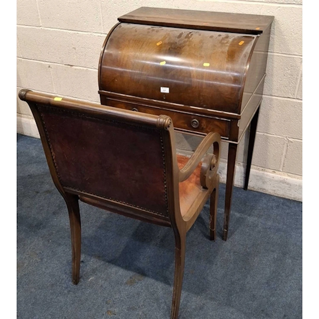 AN EDWARDIAN MAHOGANY METAMORPHIC CYLINDER FRONT BUREAU, the...