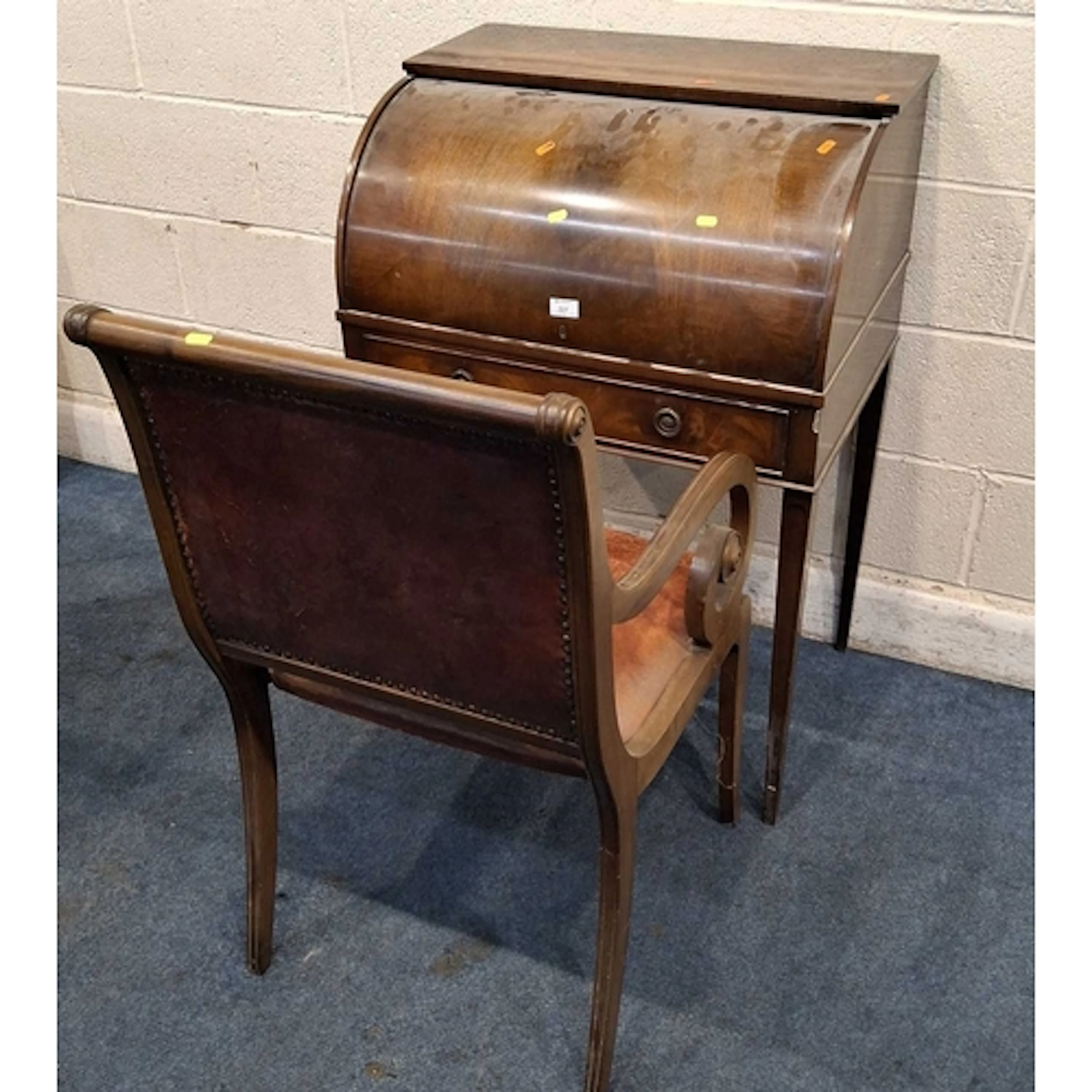 AN EDWARDIAN MAHOGANY METAMORPHIC CYLINDER FRONT BUREAU, the...