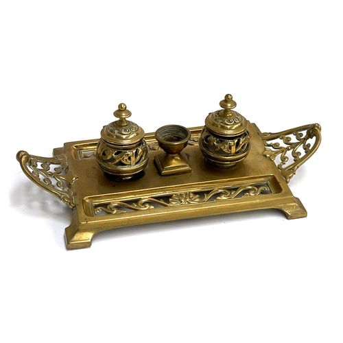 A Victorian brass inkstand, having two pierced sections for ...