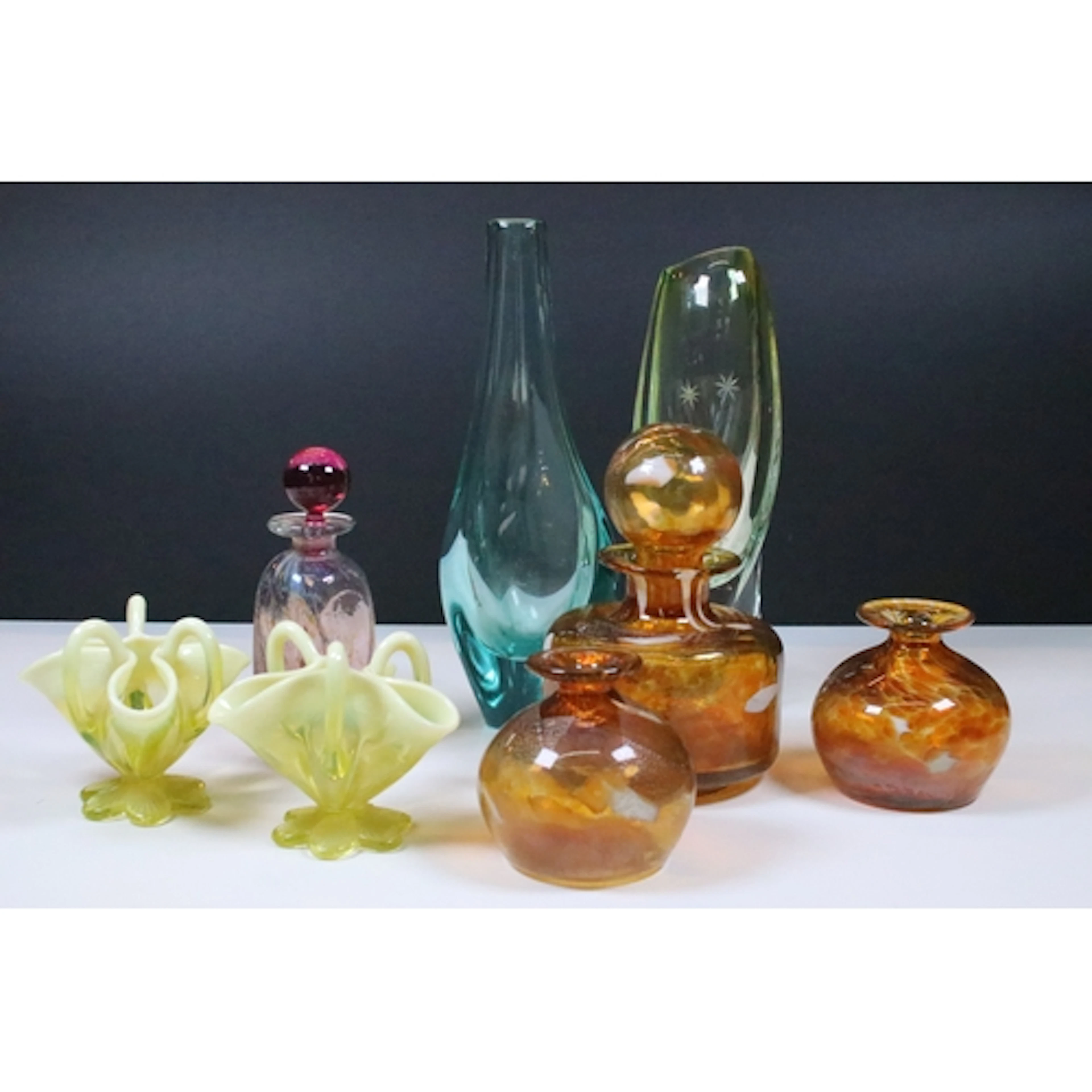 Group of four pieces of Mdina glass, to comprise two bottles...