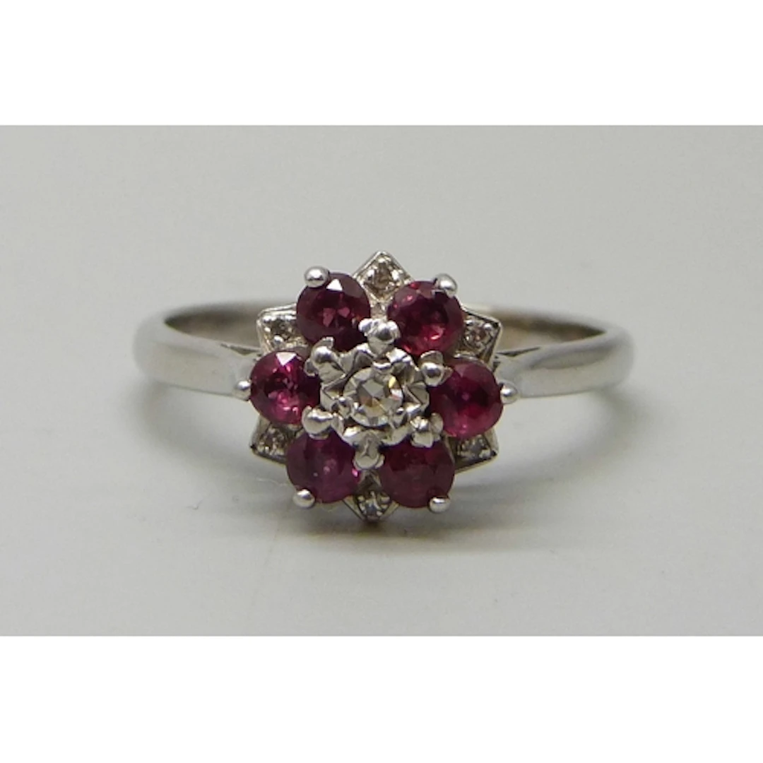 An 18ct white gold, ruby and diamond cluster ring, 4.4g, S